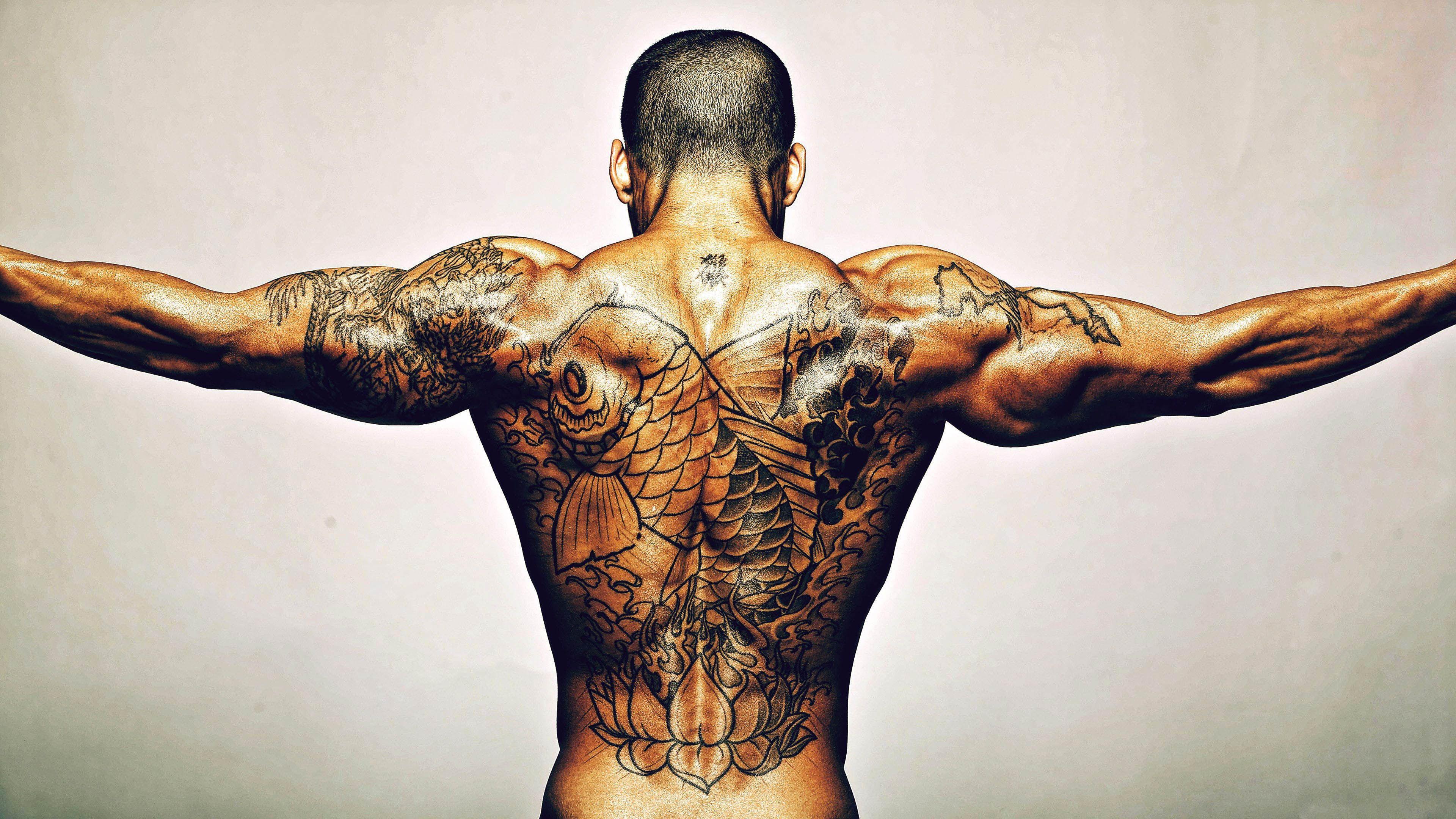 Topless man with koi fish back tattoo HD wallpaper