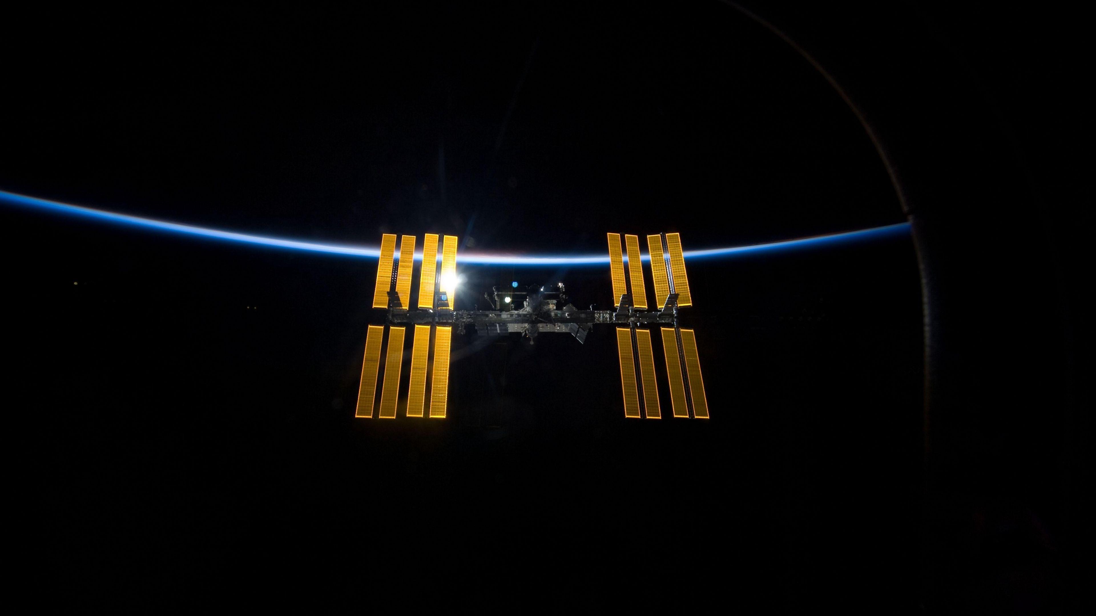 Download wallpaper 3840x2160 space, station iss, world, laboratory, light 4k uhd 16:9 HD background