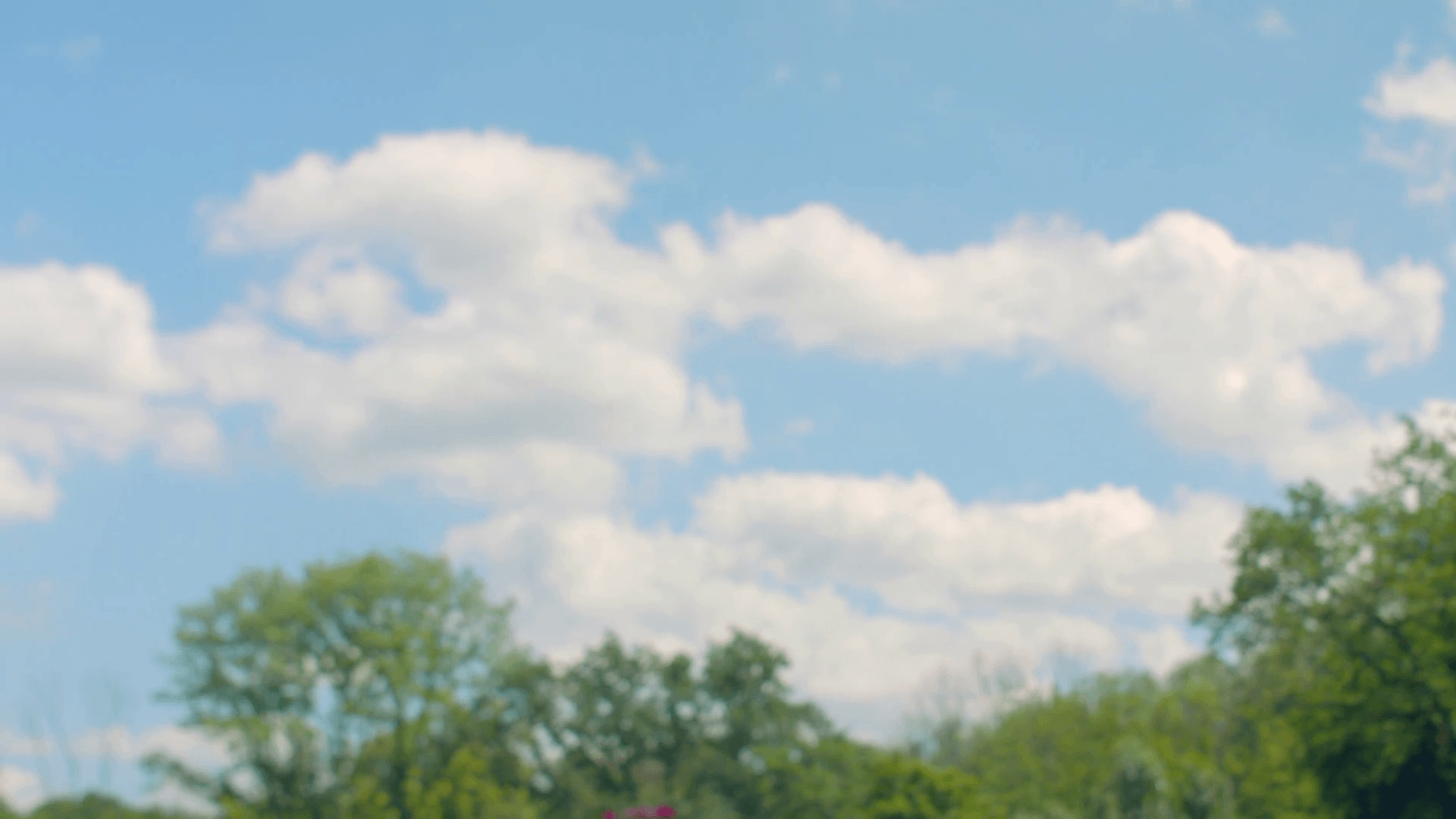 Fitness woman running in slow motion. Girl runs on sky background