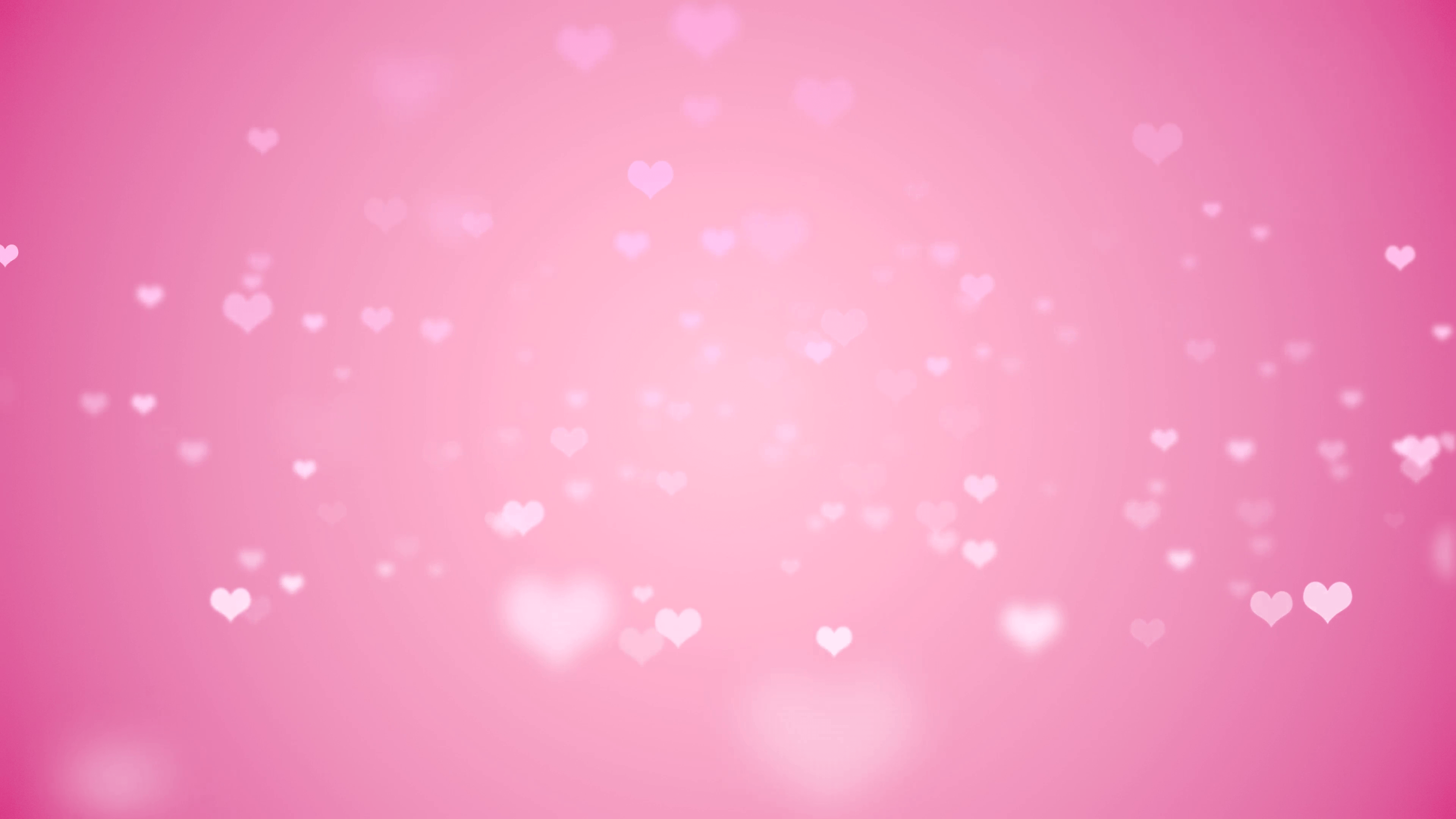 Floating light pink hearts fade in and out against a pink backdrop