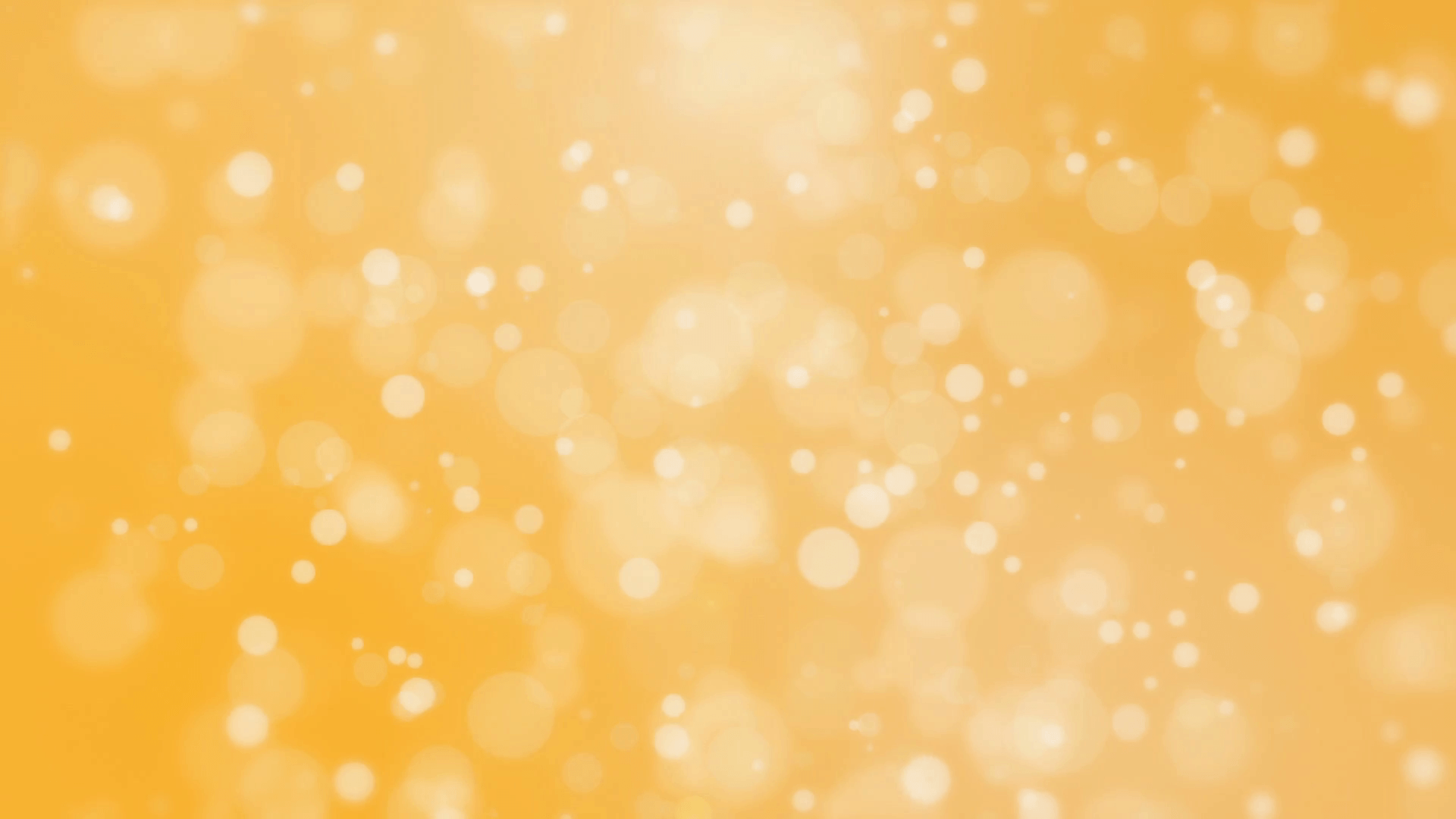 Beautiful golden yellow background with glowing light particles