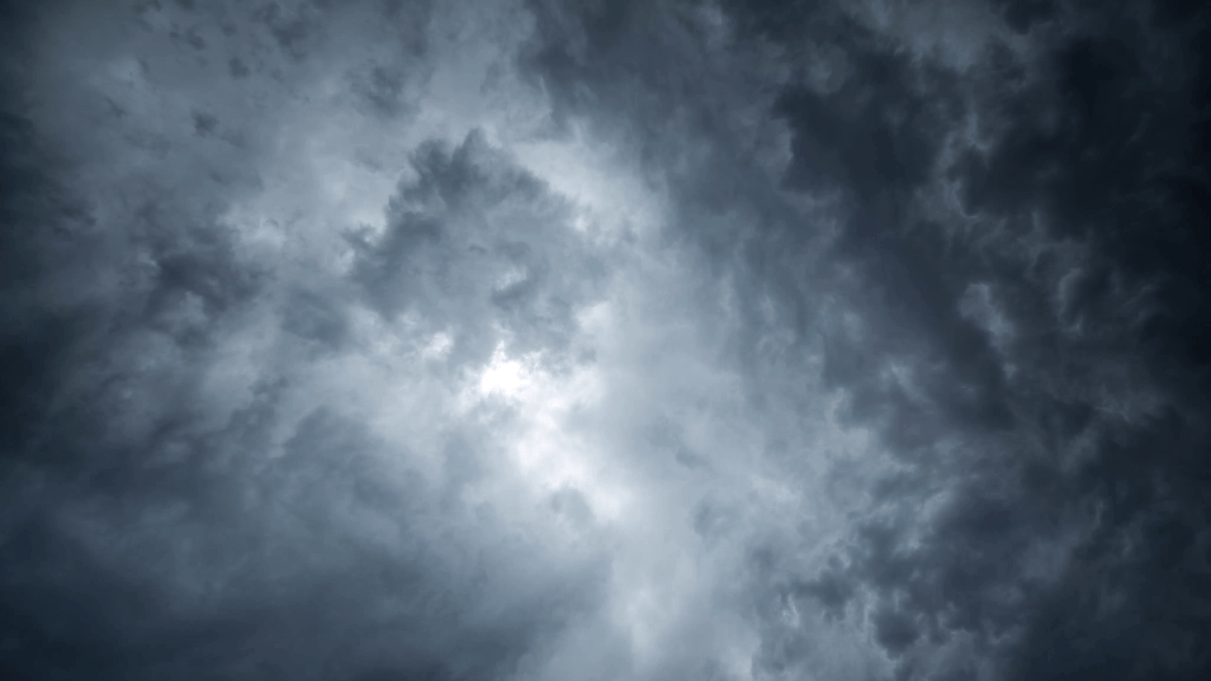 Grunge dark grey storm clouds motion background. 4K timelapse. Stock