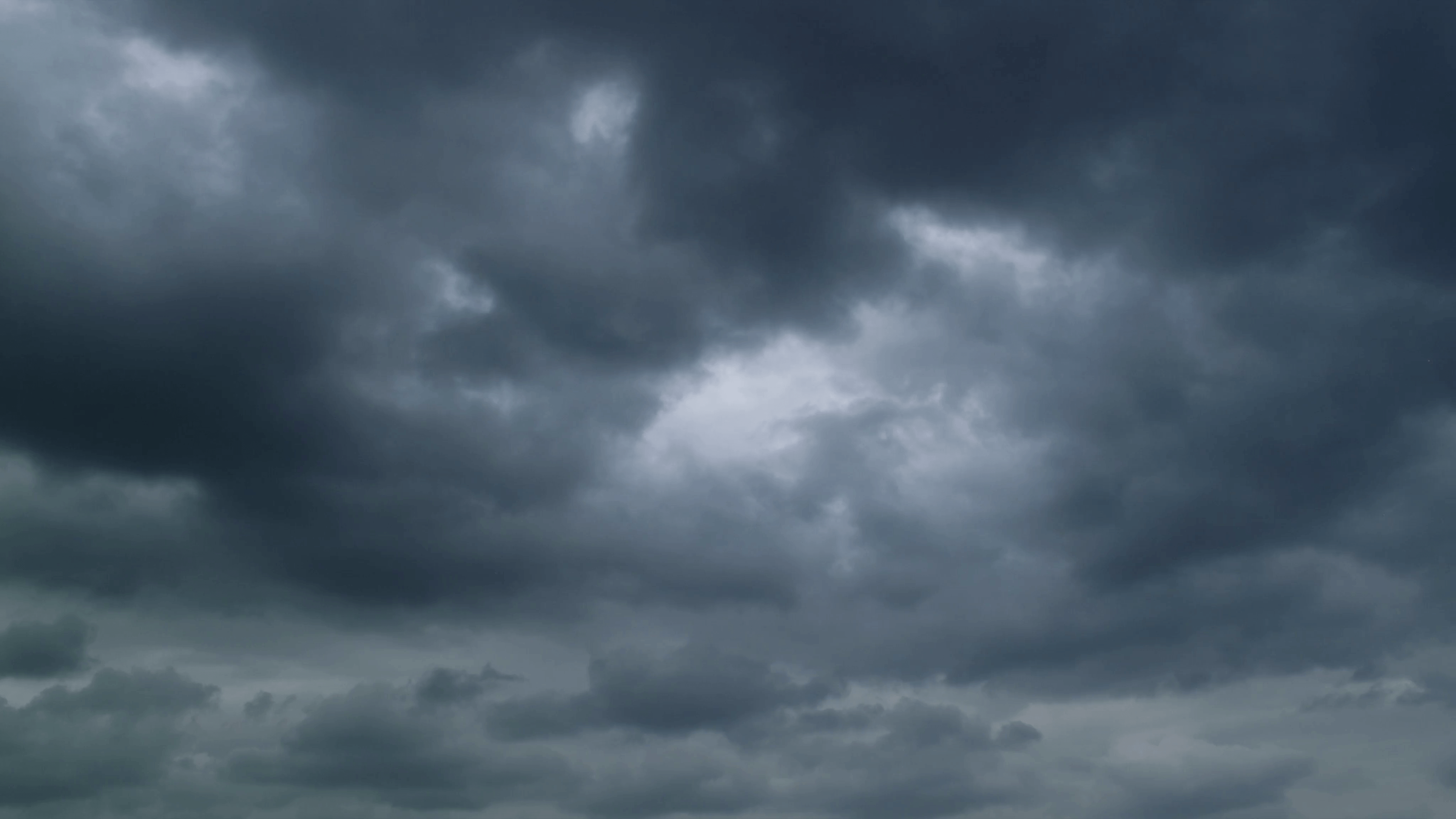 Dark grunge stormy clouds motion background. 4K UHD timelapse. Stock