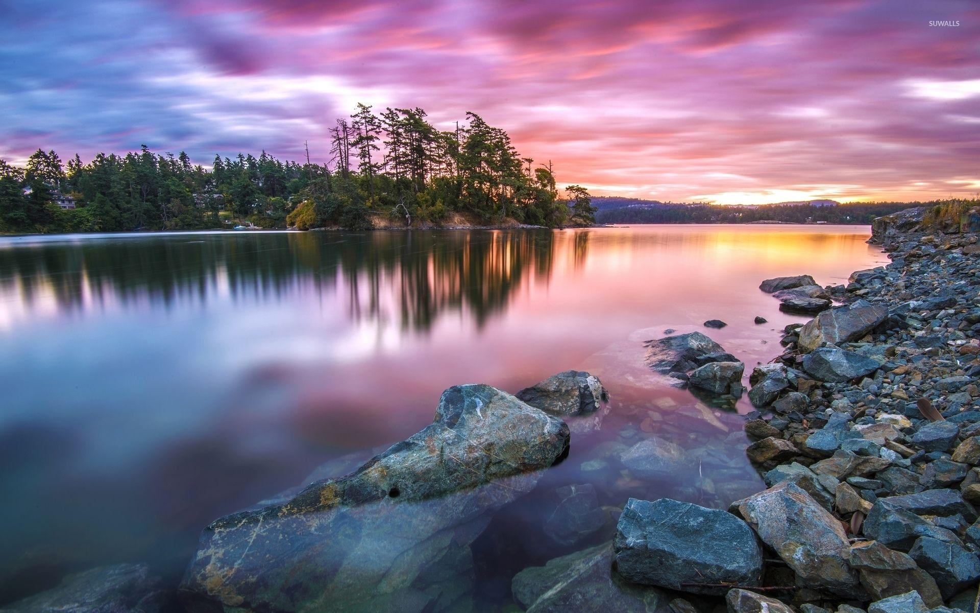 Amazing sunset colors reflected in the clear water wallpaper