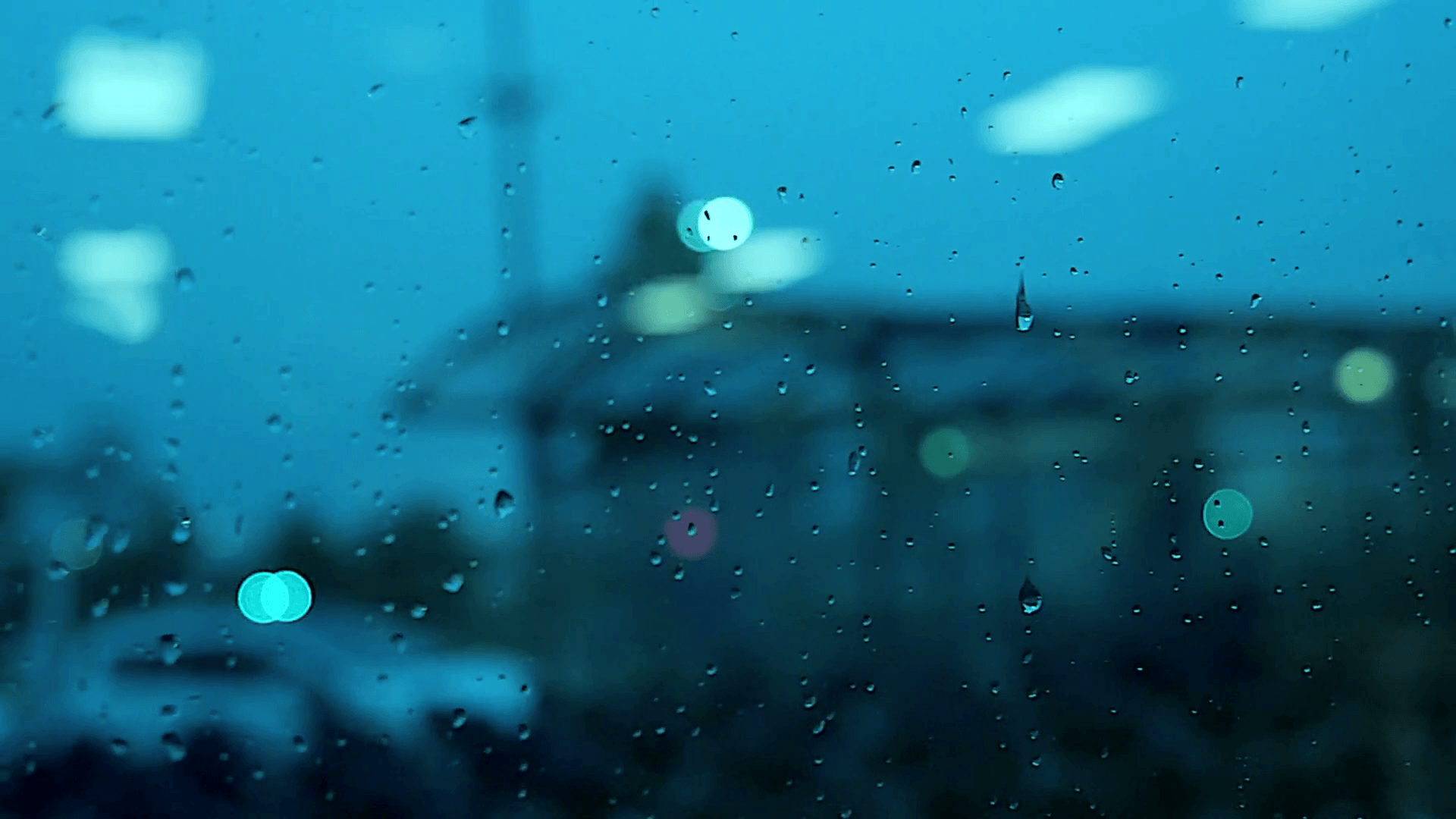 water drops on window. rain raining. crying sadness sad. blurred