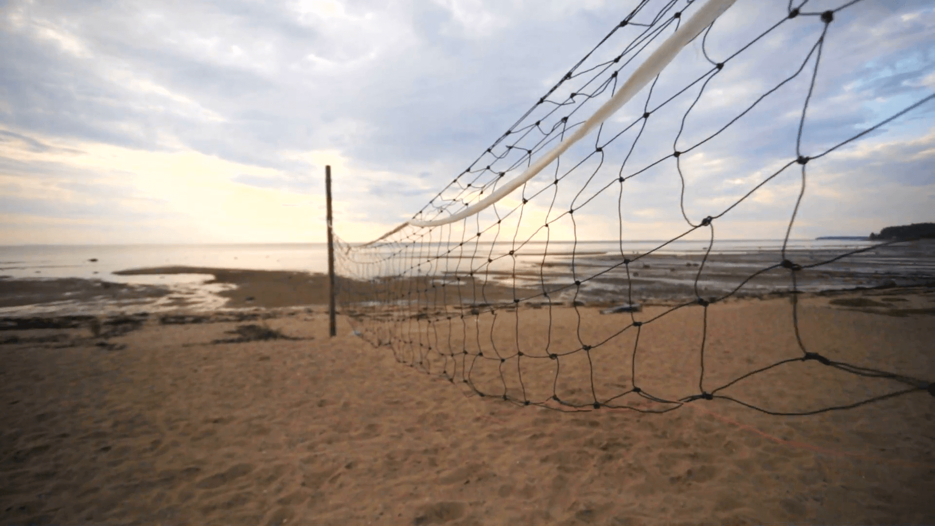 A closeup of volleyball court divider net on the beach. Stock Video