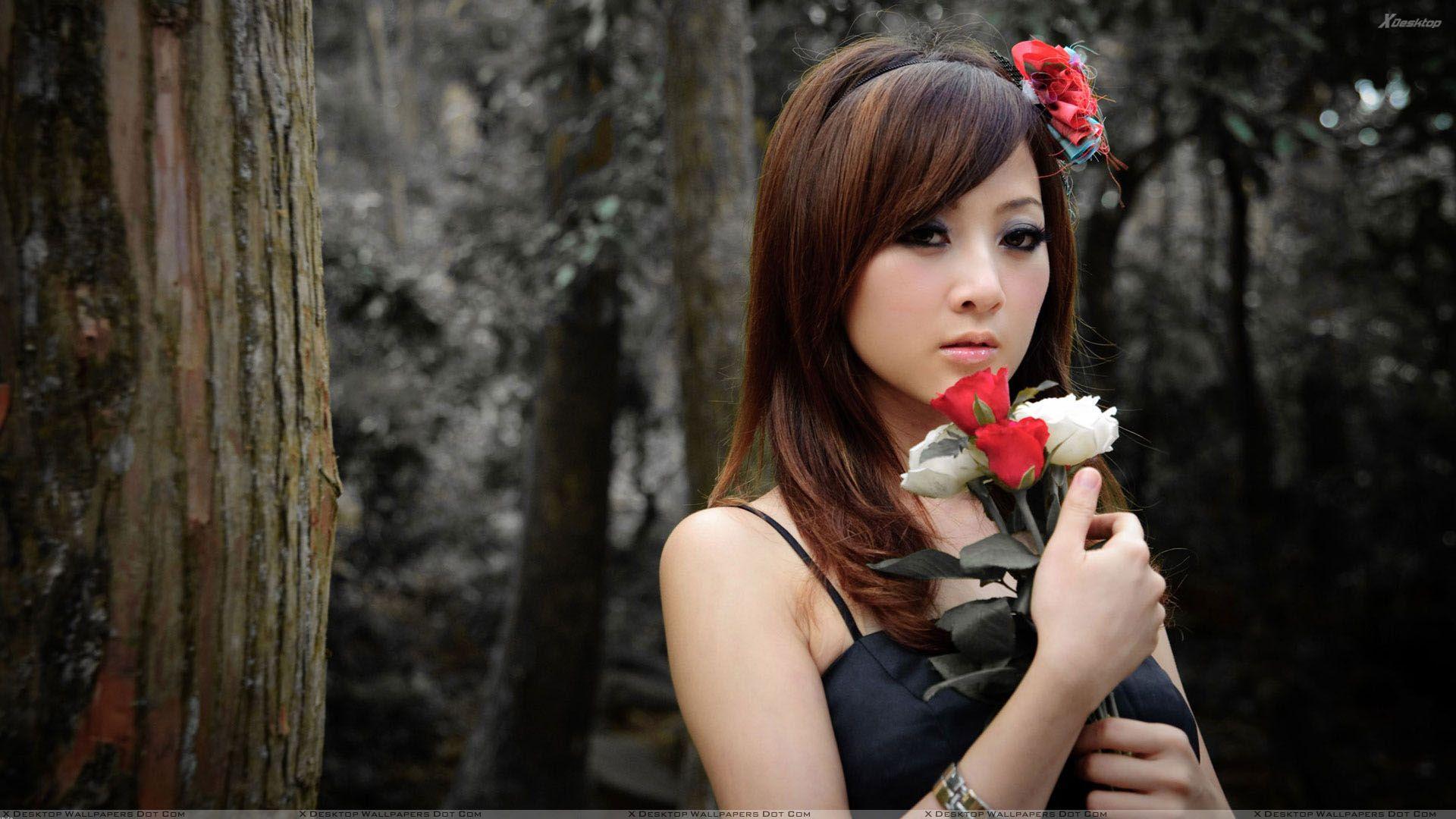 Asian Girl With Red And White Roses in Forest Wallpaper