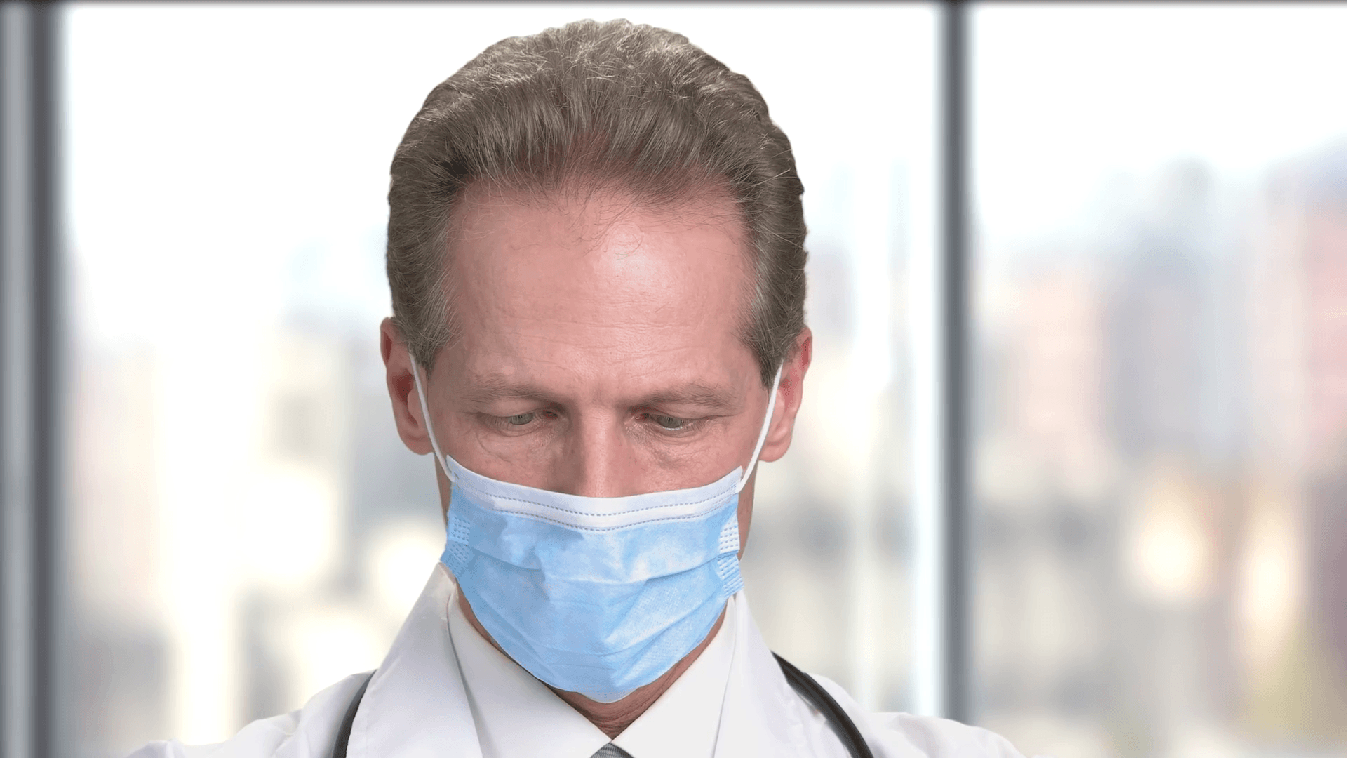 Close up face of a surgeon doctor working. Serious mature doctor