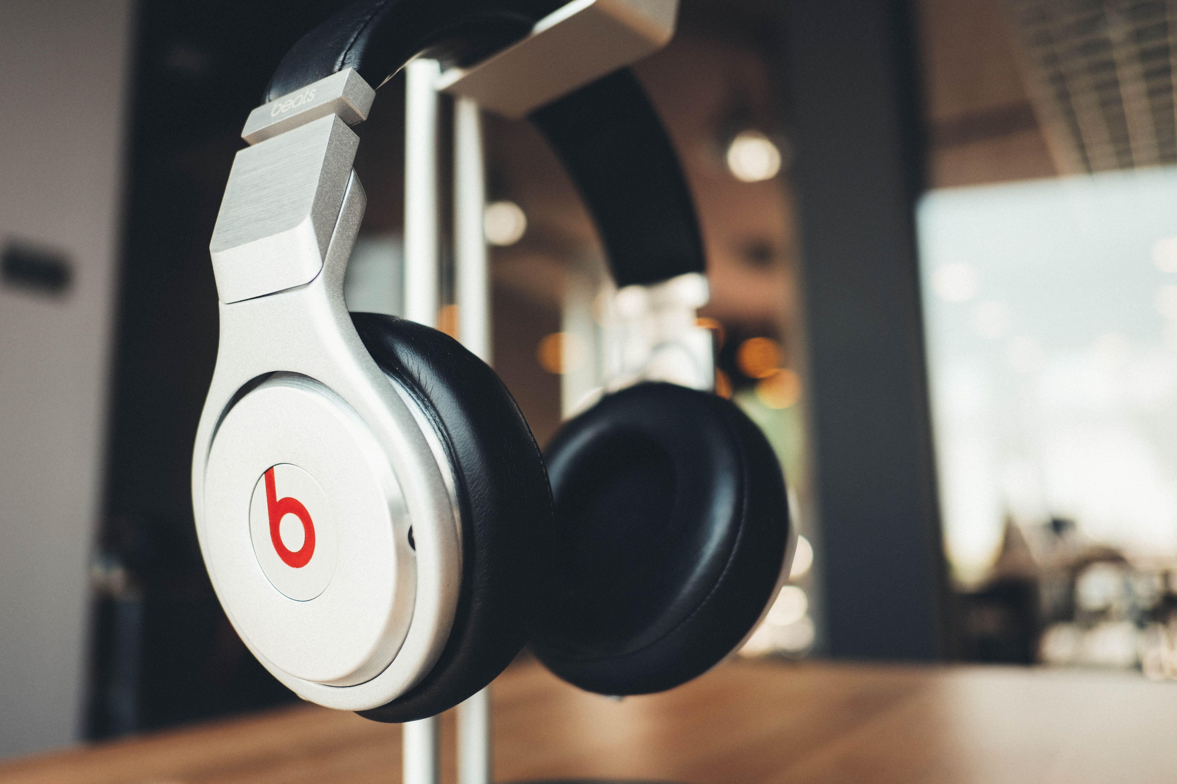 Selective focus photography of white Beats by Dr. Dre headphones HD