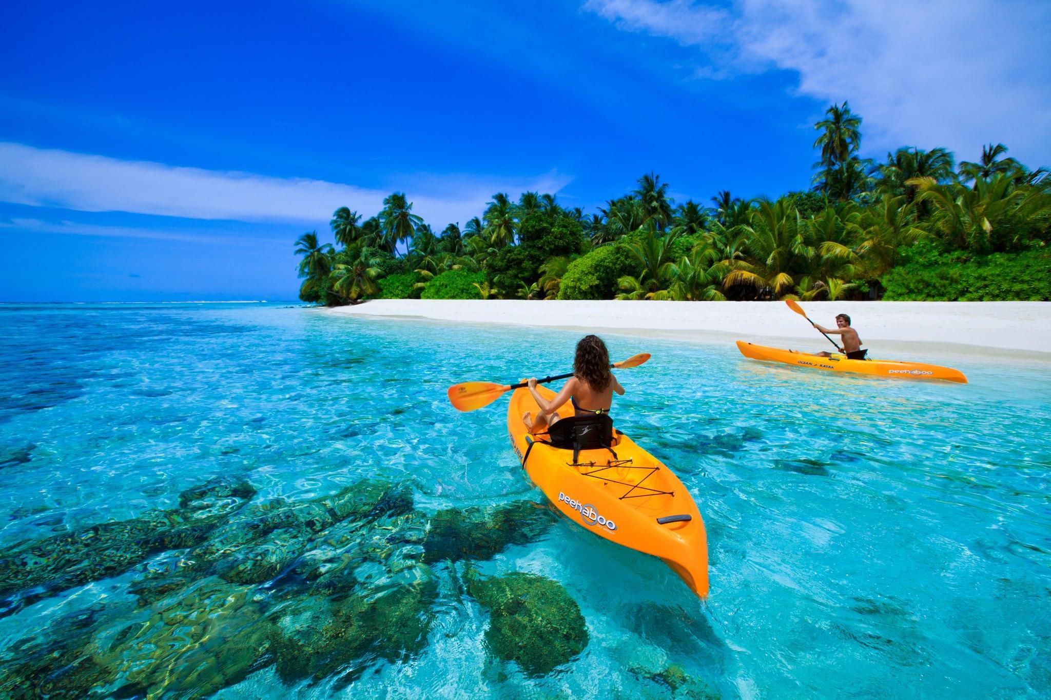Canoe On Blue Lagoon In Maldives wallpaper