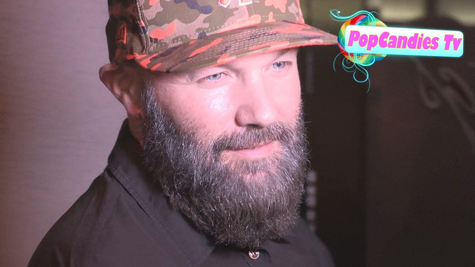 Fred Durst & Girlfriend meet up with paparazzi while departing