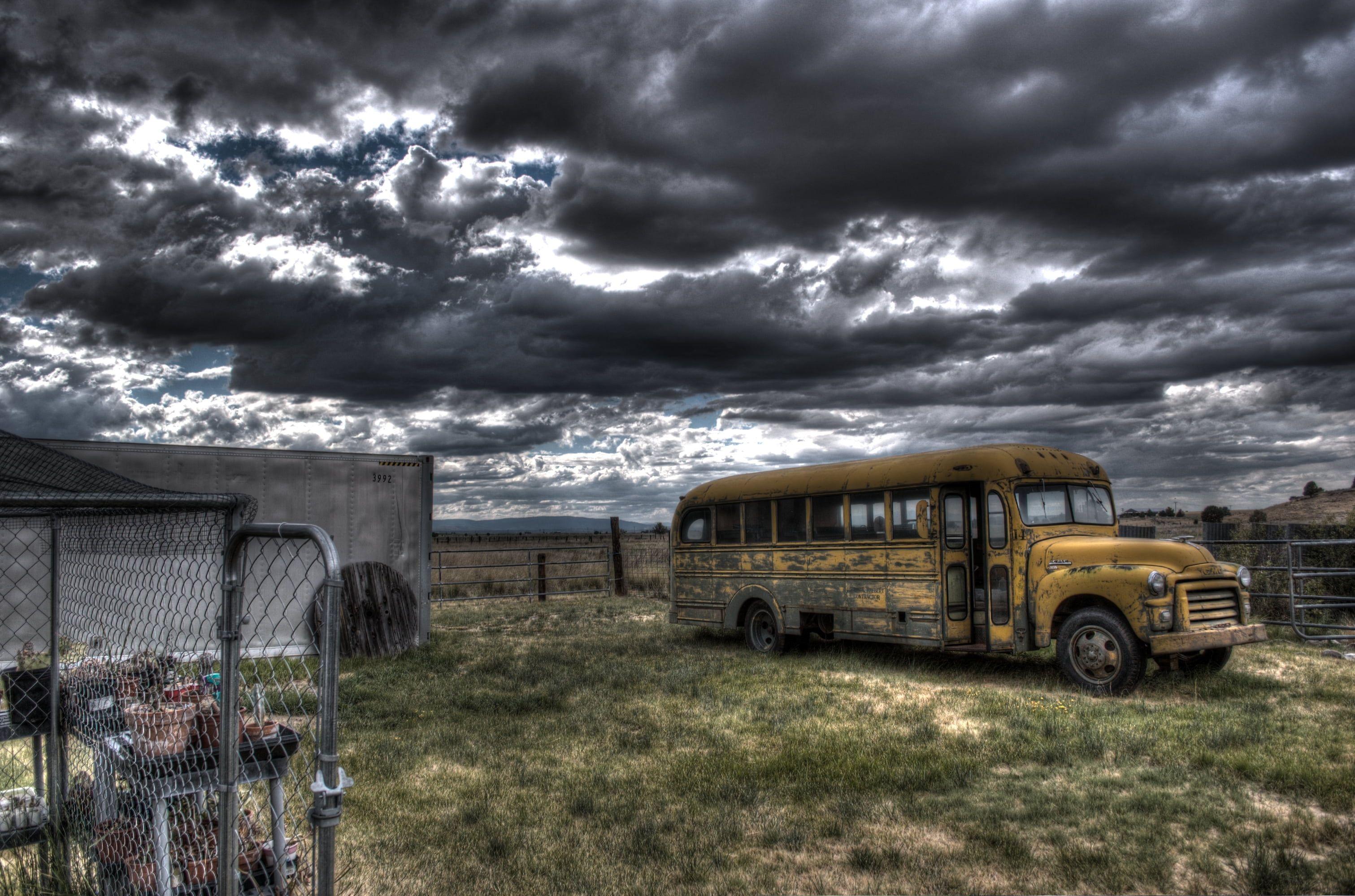 Photography of school bus near fence HD wallpapers