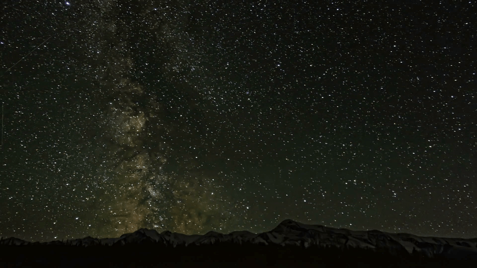 Timelapse night sky stars milky way on mountains background. 4K