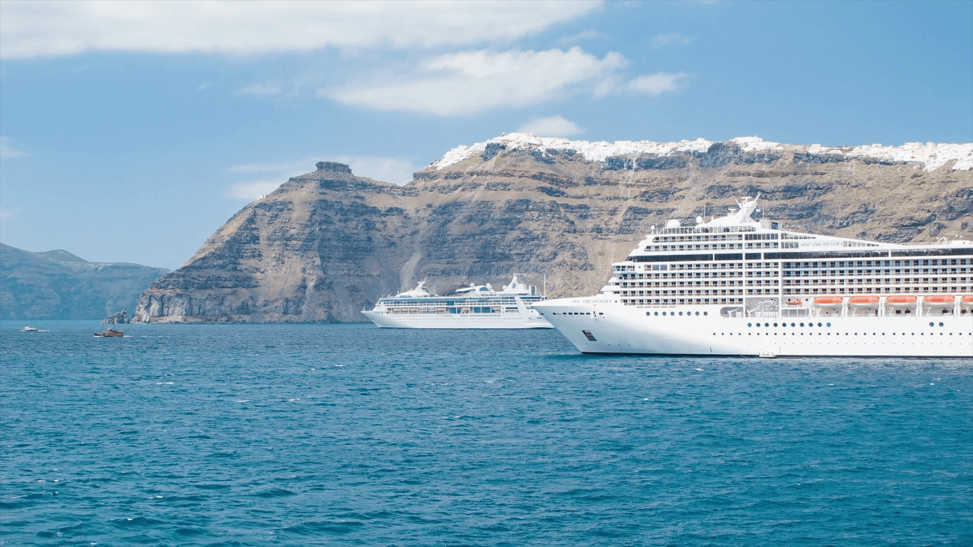 Cruise Ships Anchored at Santorini Greece with the City of Oia
