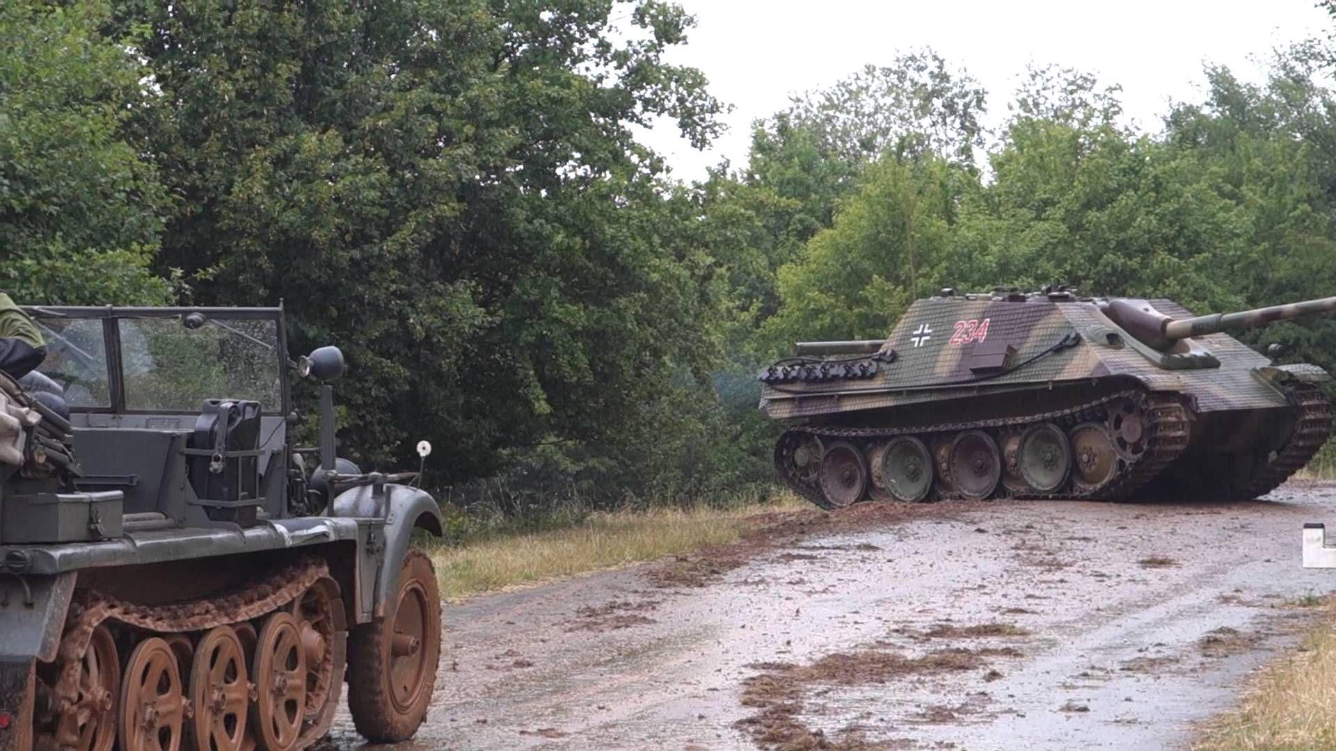 jagdpanther and halftrack transport in reenactment exercise