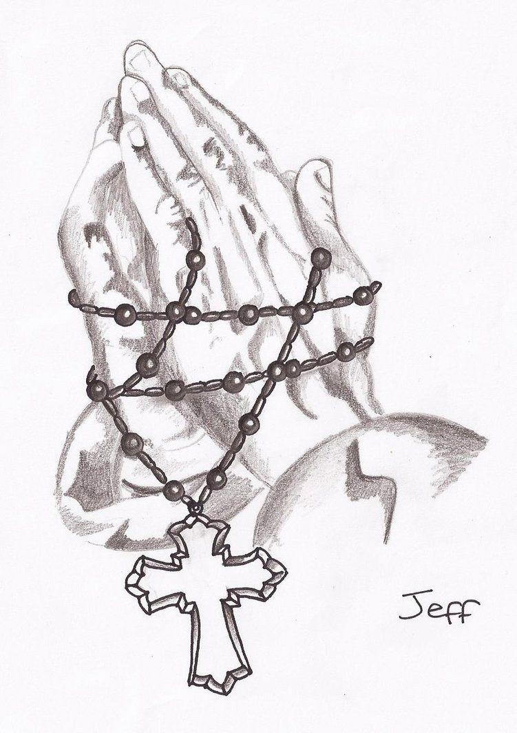 Praying hands and rosary beads