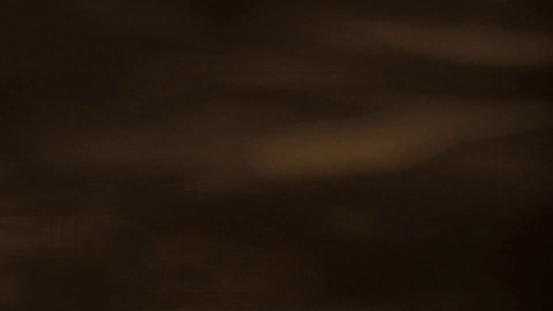 Fast gold glitter on the water of the sea background dark sepia