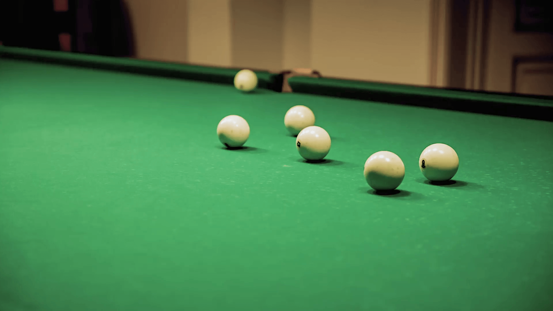 The exact blow on a billiard ball. You can use this video in your