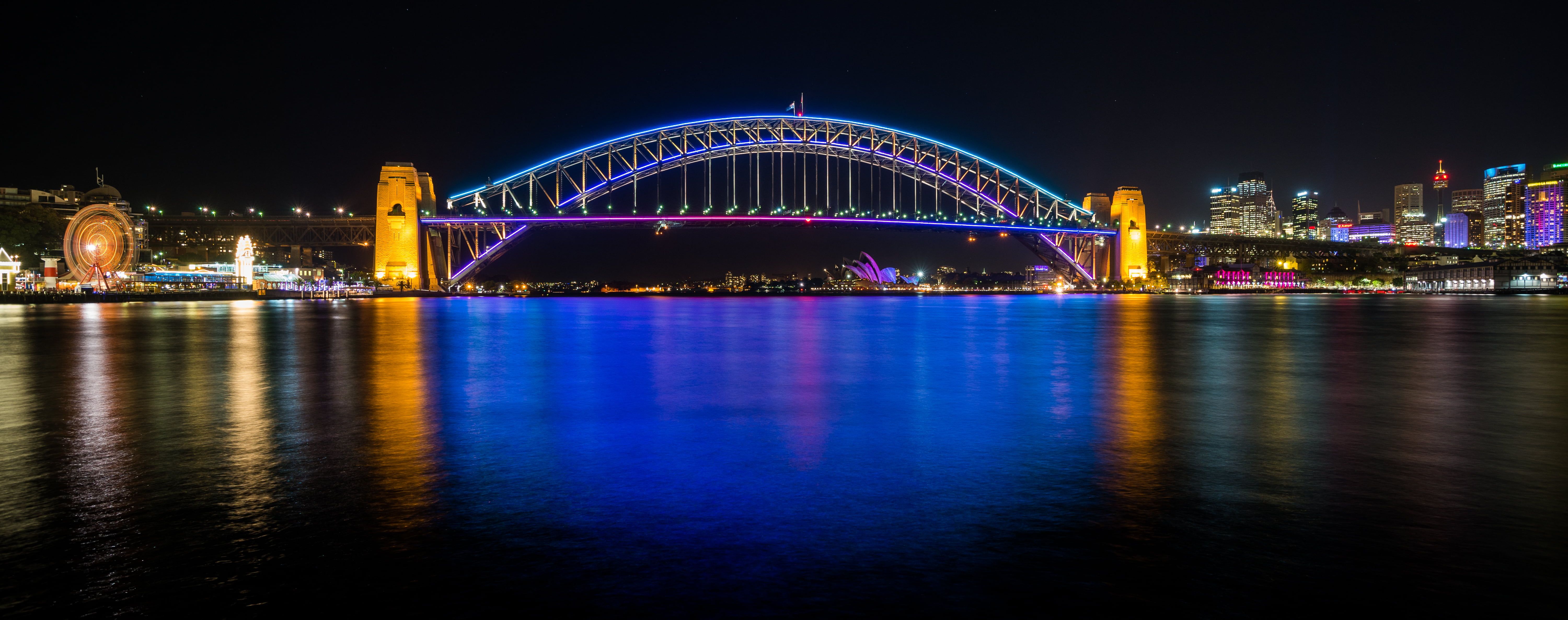 Lit Sydney Opera House in Australia at night HD wallpaper