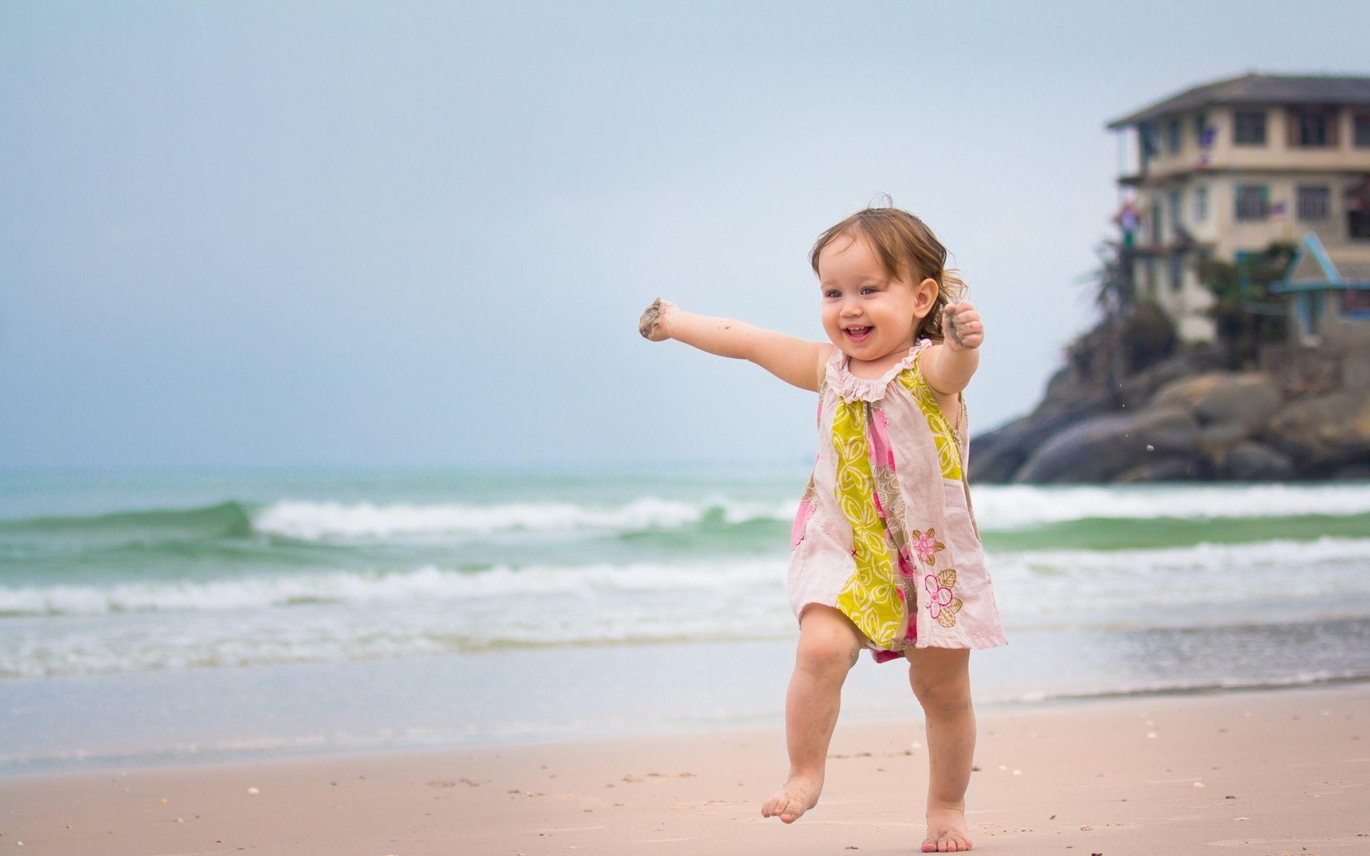 Happy Girl Running In Beach wallpaper