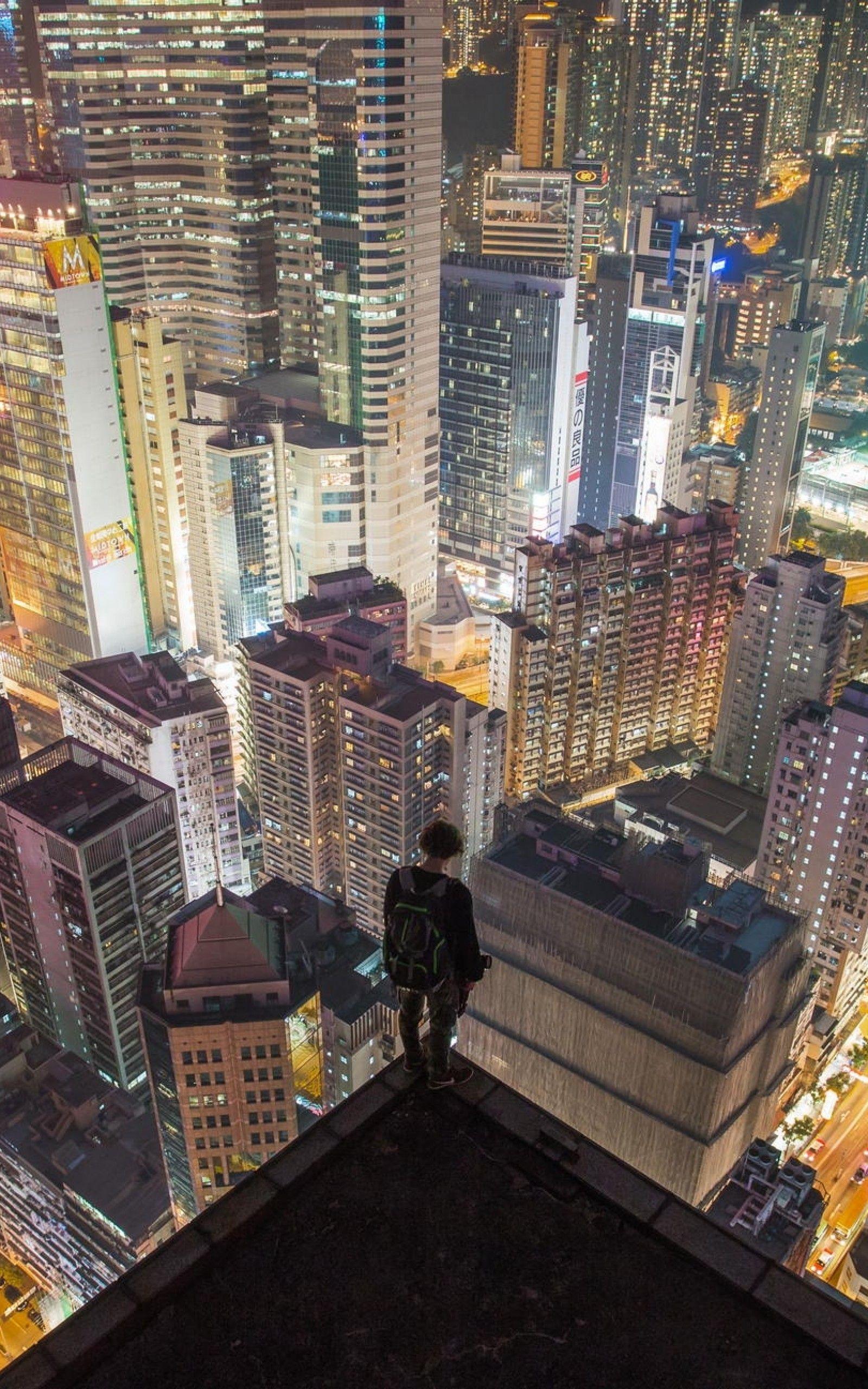 Download 1600x2560 Hong Kong, Cityscape, Night, Skyscrapers, Man