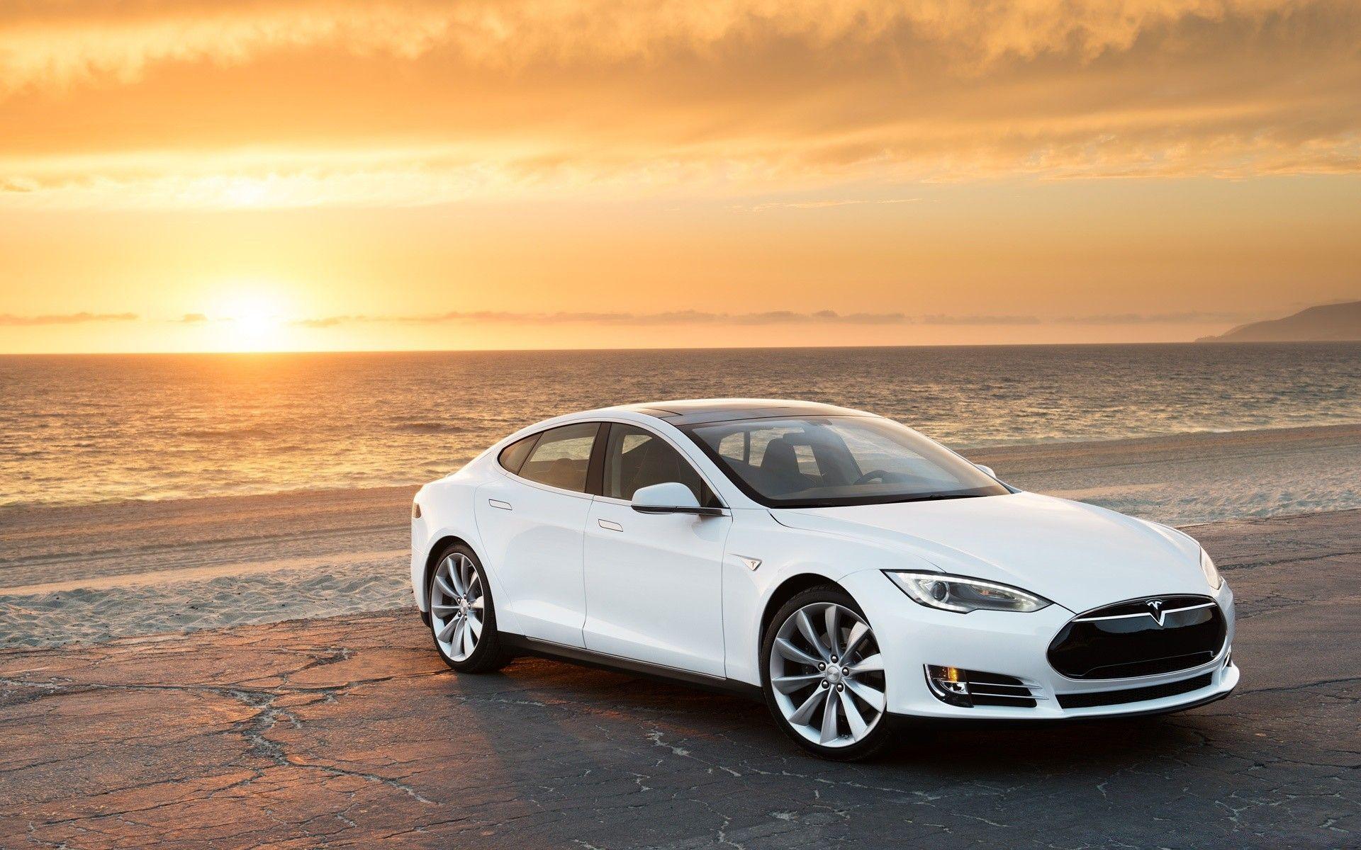 Tesla Model S in White, At the Beach. Android wallpaper for free