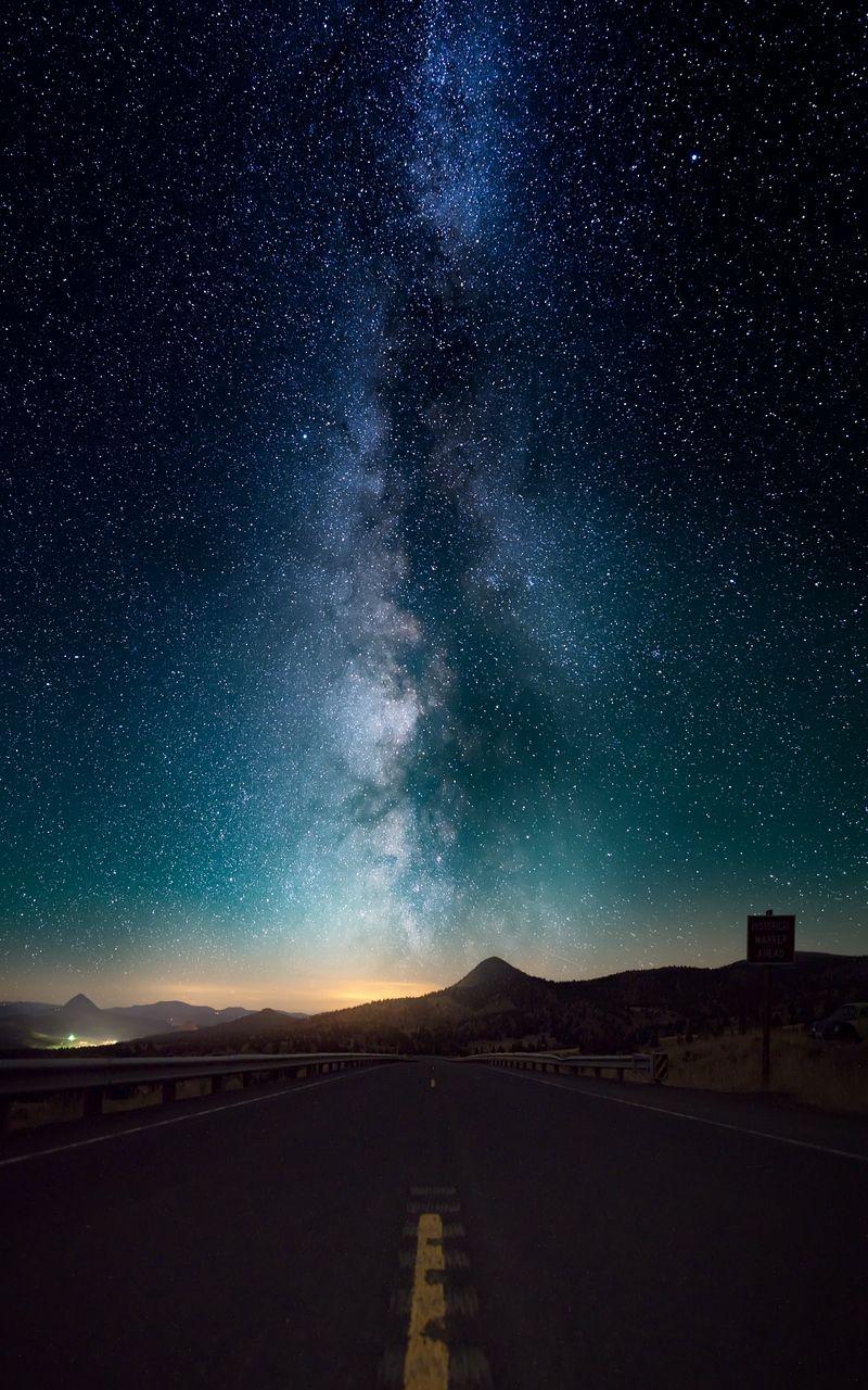 Download wallpaper 800x1280 starry sky, horizon, night, road samsung