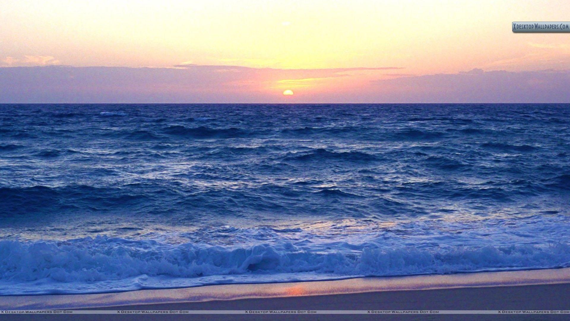 Beach With Sunset And Waves Of The Atlantic Ocean Wallpaper