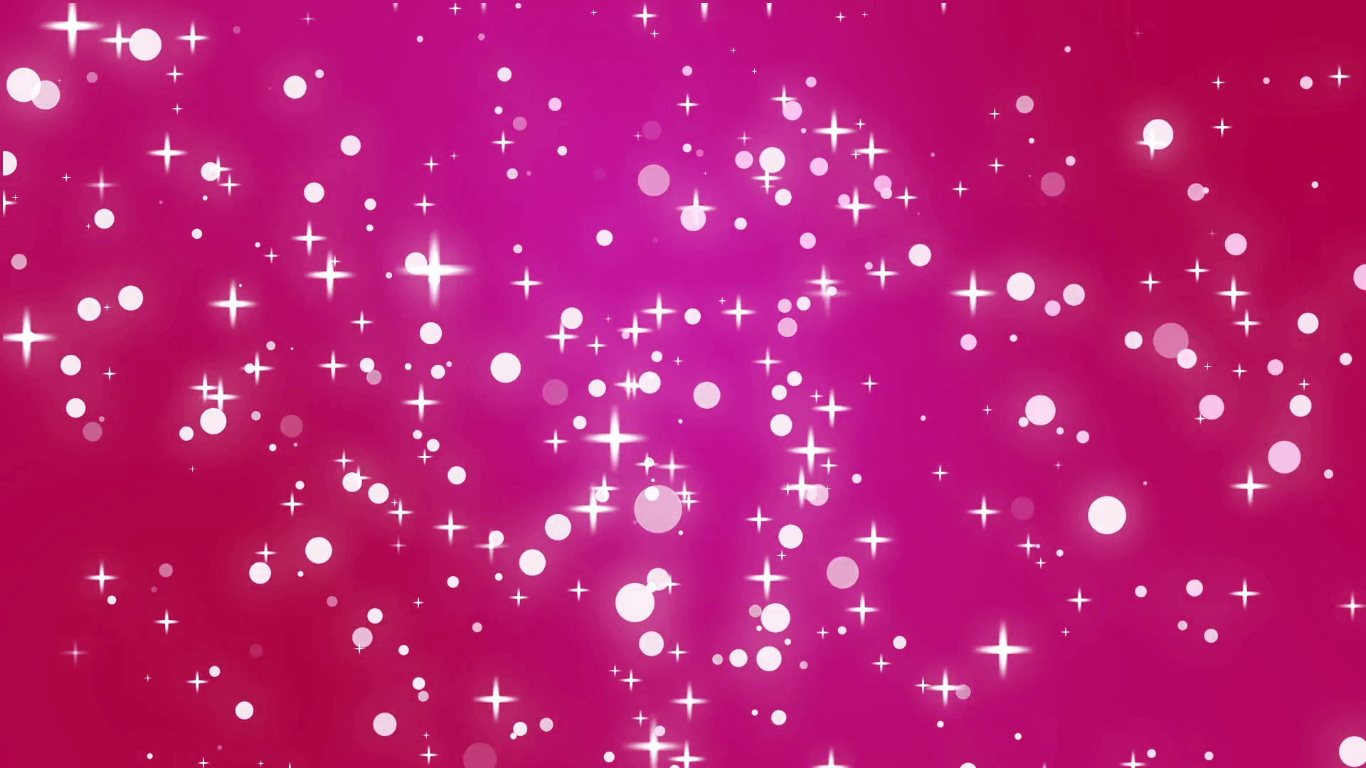 Pink shimmering stars shoot across a dark background. Motion