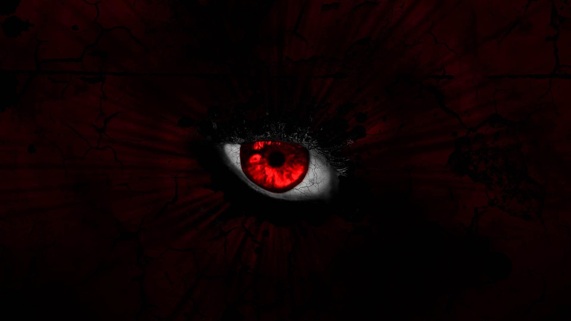 Download A Devil With Red Eyes And Horns On His Face Wallpaper