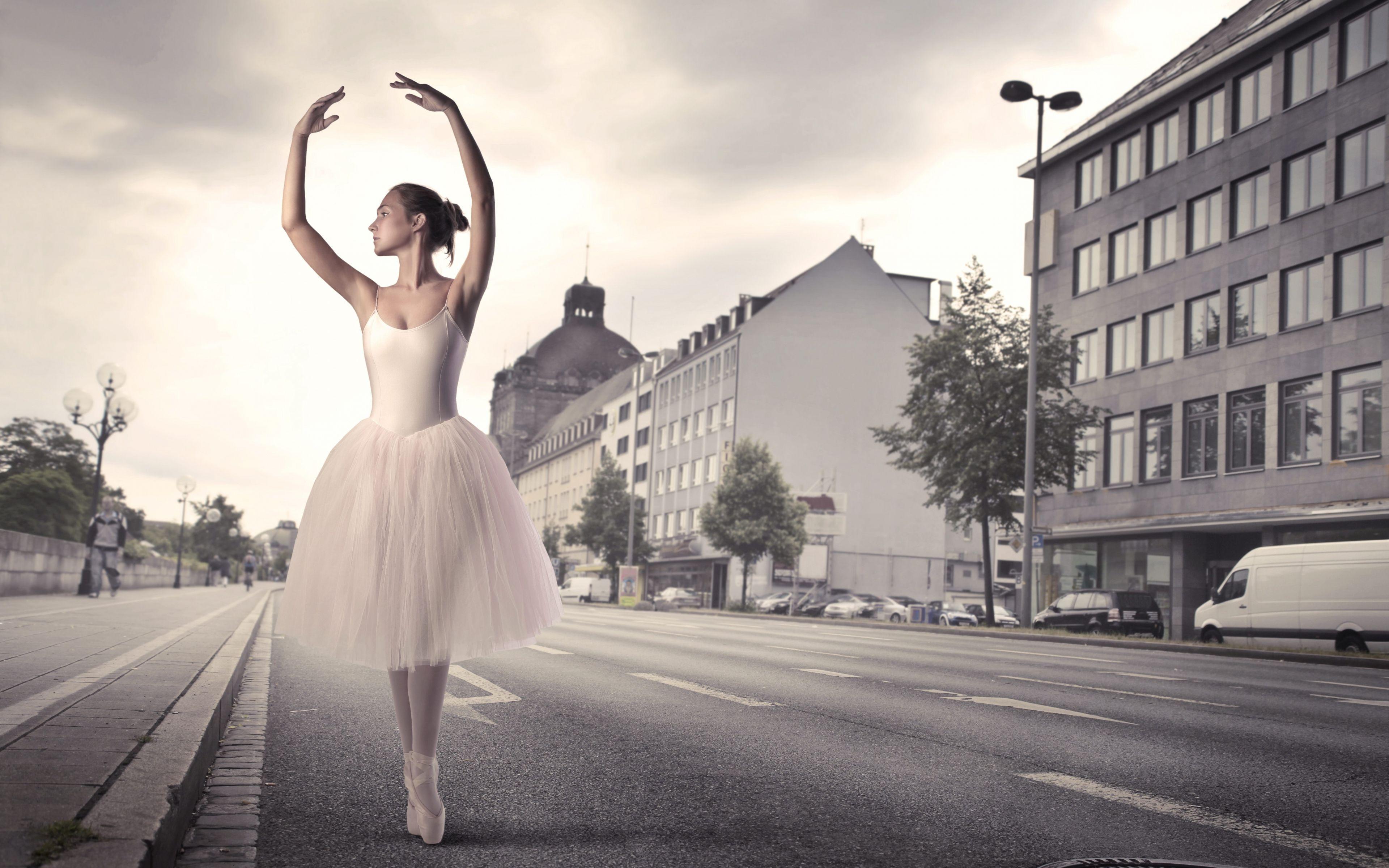 Ballerina dancing in the street wallpaper and image