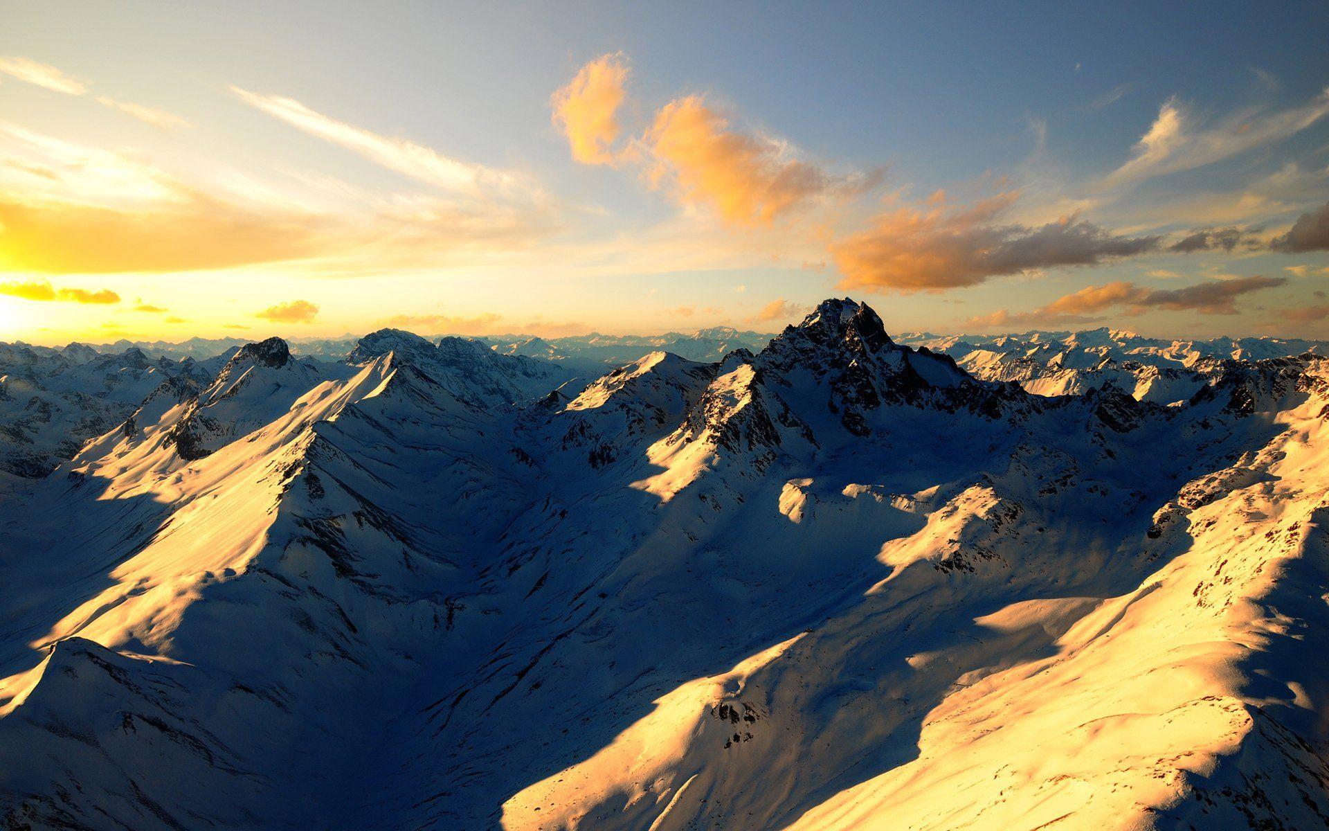 Sunset on a snowy mountain HD Wallpaper. Background Image