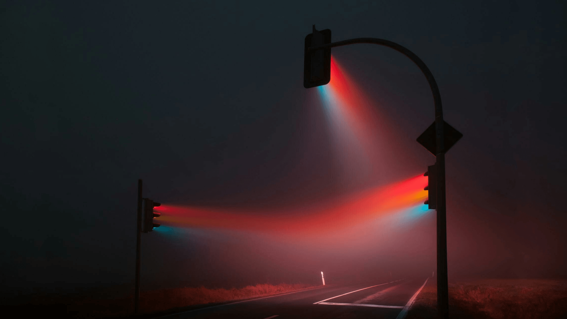 Traffic lights in the fog at night