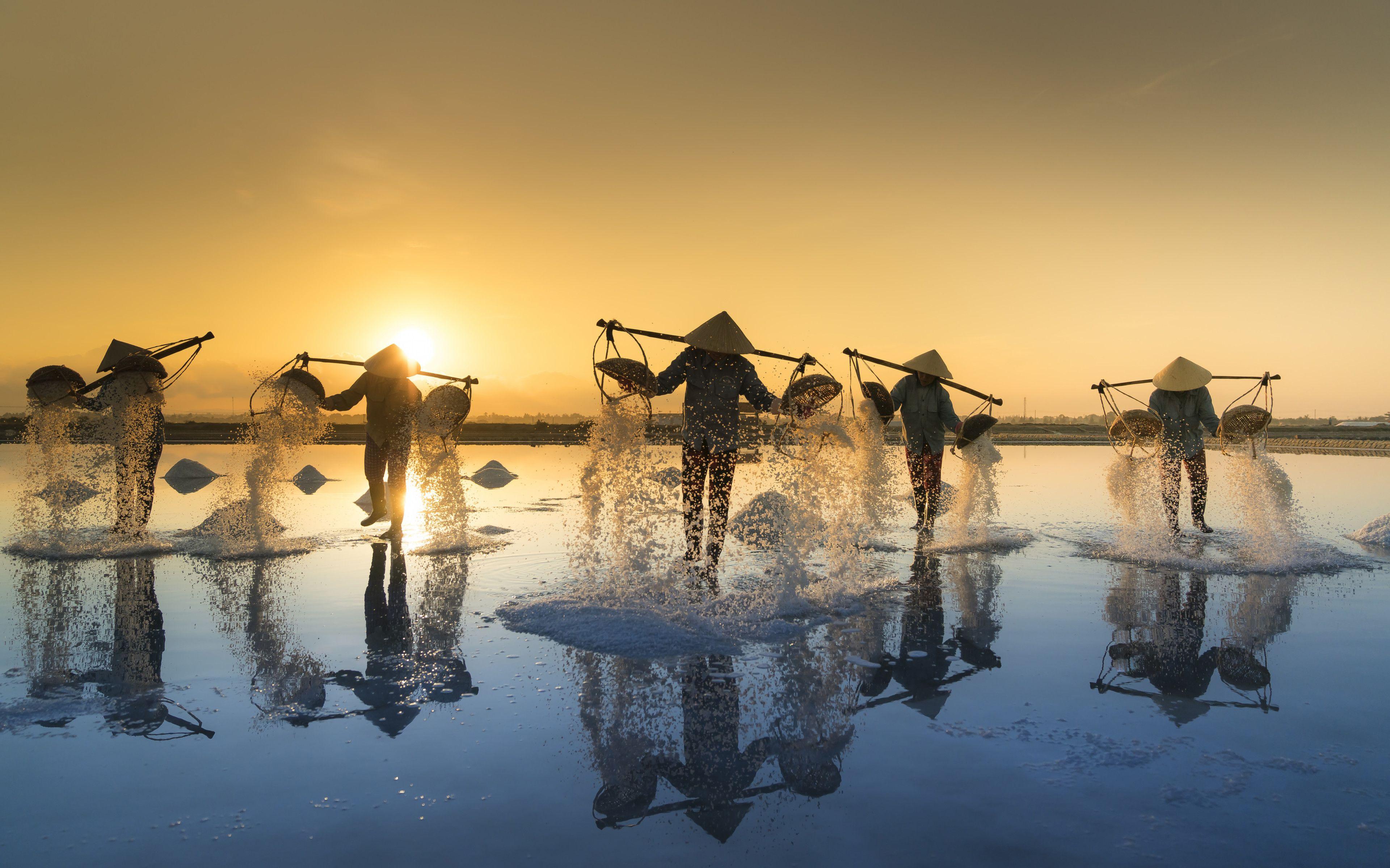 Farmers in The Hon Khoi Salt Fields, Vietnam widescreen wallpaper