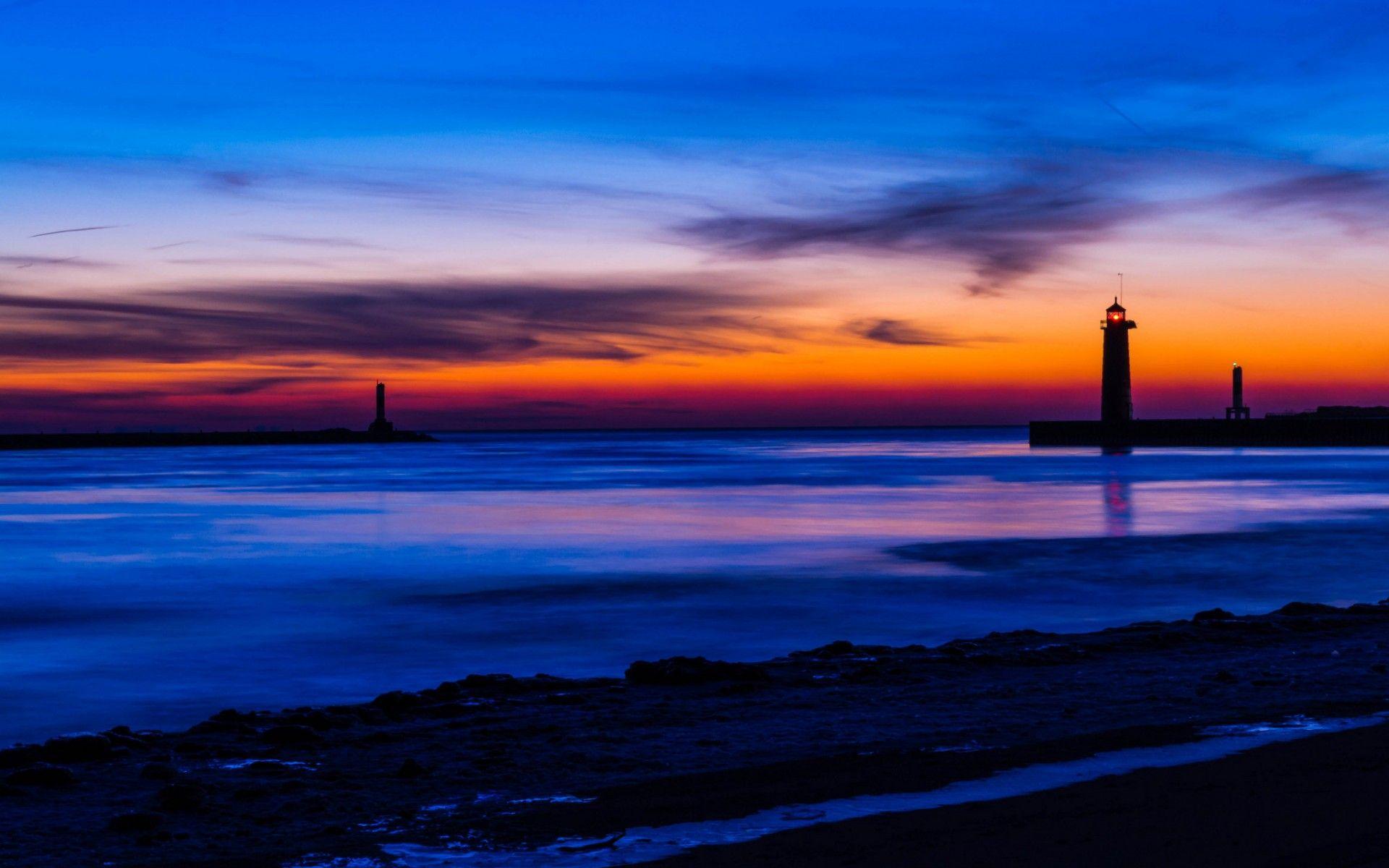 USA Michigan lake beach lighthouse night orange sunset blue sky