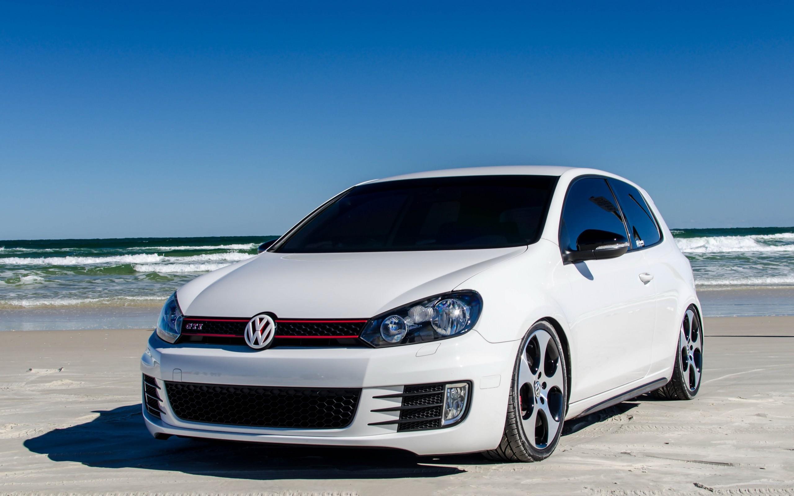 White Volkswagen Golf Mk6 GTI on the beach wallpaper and image