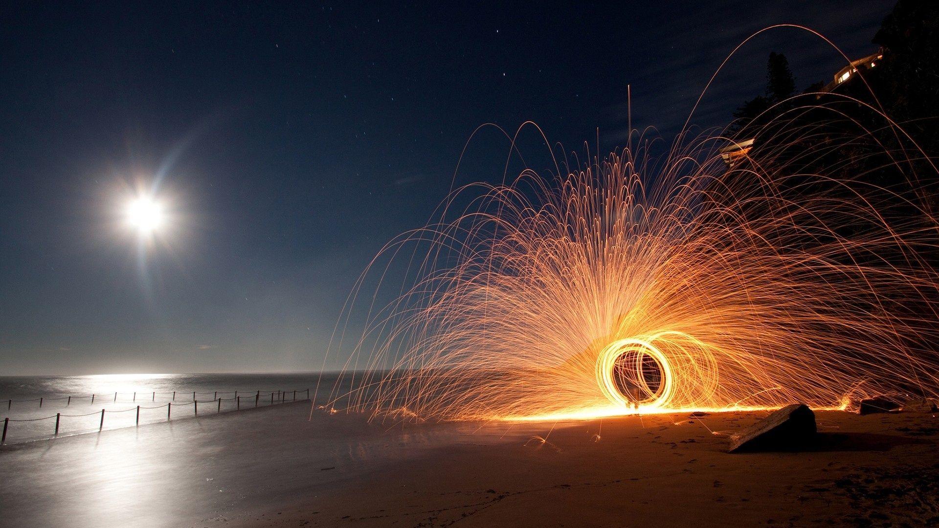 Circular Sparkler On A Beach At Night HD Desktop Background