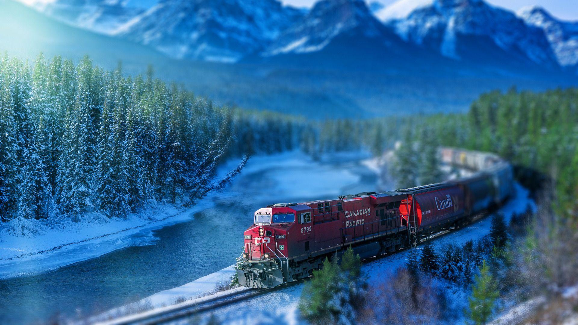 train railroad track winter landscape mountains river snow tilt
