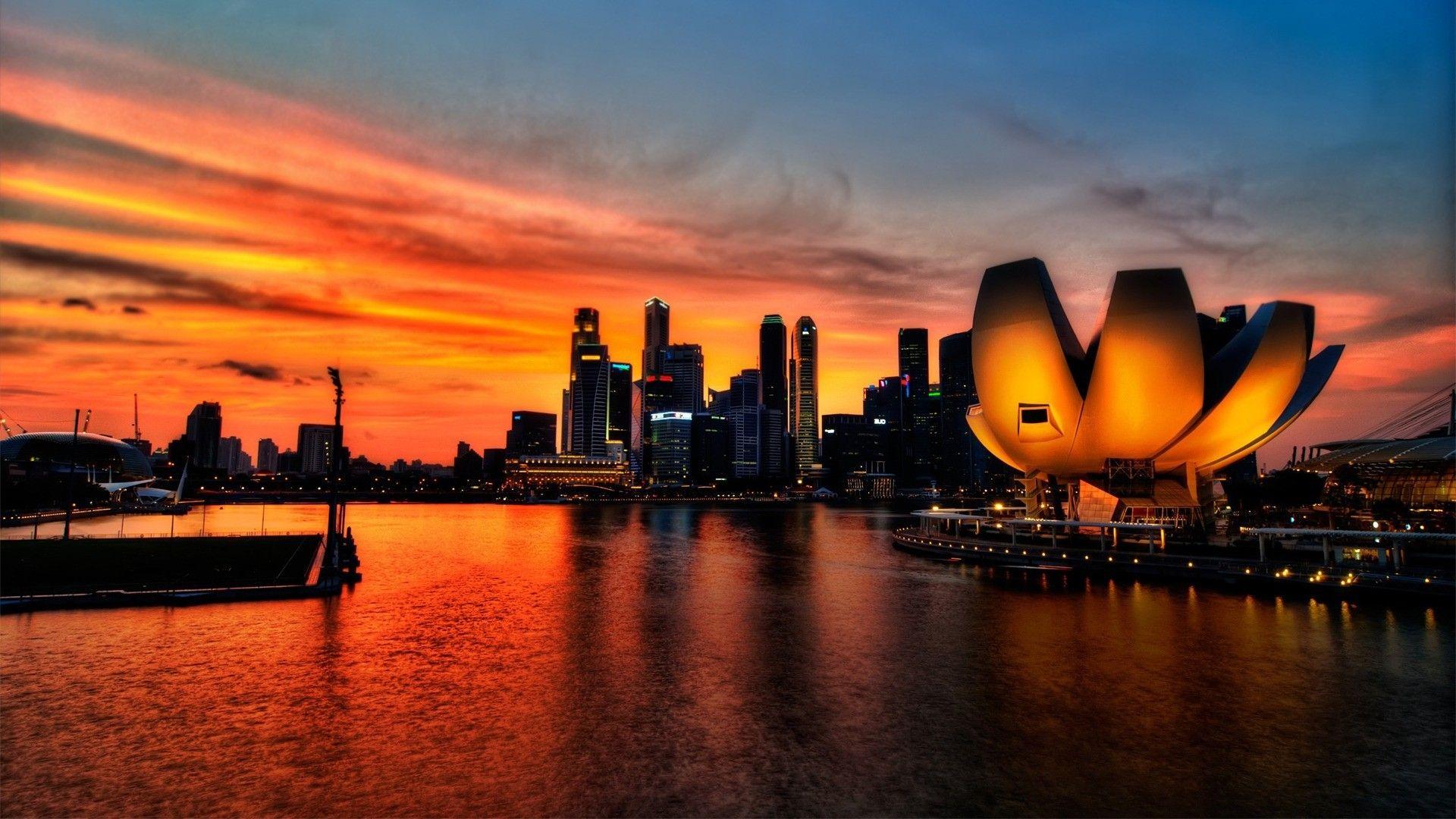 Futuristic city at sunset HD Desktop Wallpaper. HD Desktop Wallpaper