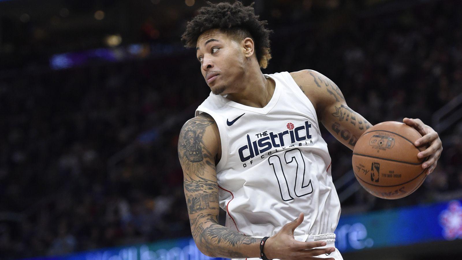 Watch: Kelly Oubre caught untying Rodney Hood's sneakers during game
