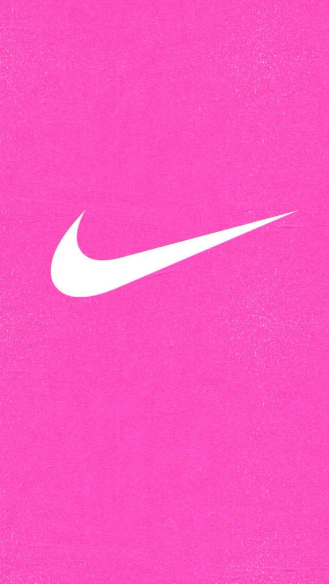 Download A Pink And White Pattern With Nike Logos Wallpaper