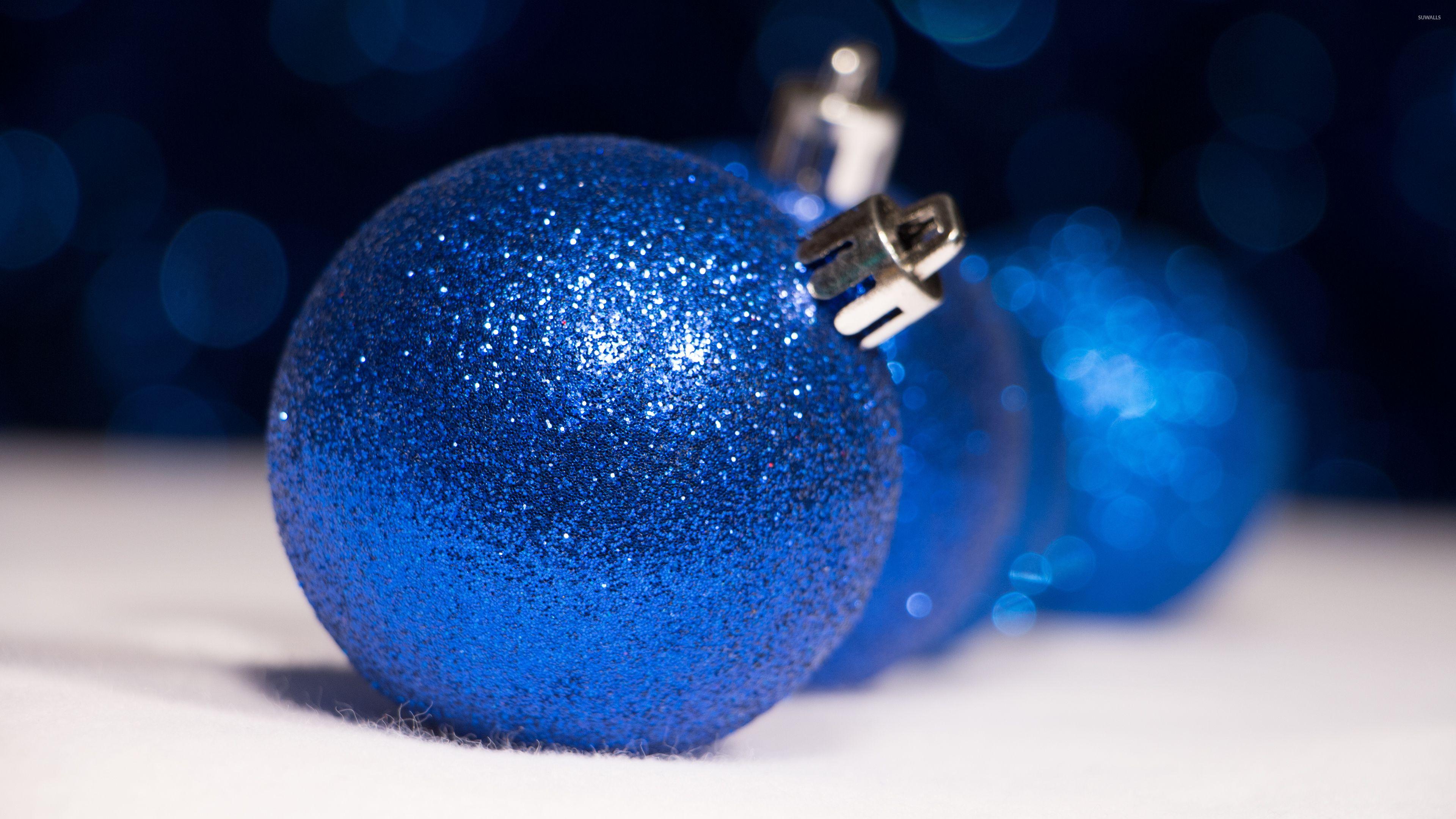 Sparkly blue Christmas ornaments wallpaper wallpaper