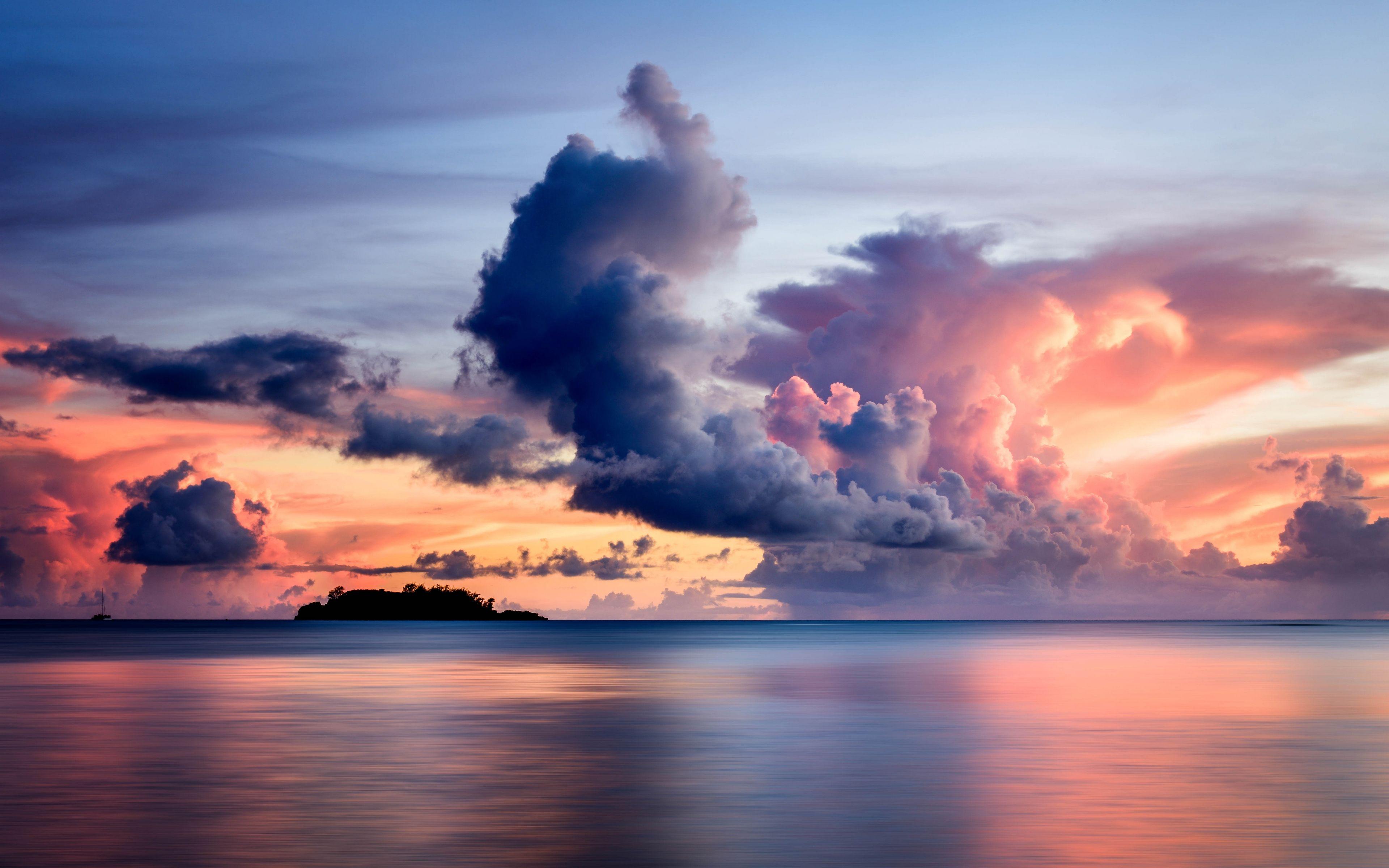 Download wallpaper 3840x2400 sea, clouds, horizon, island, sky