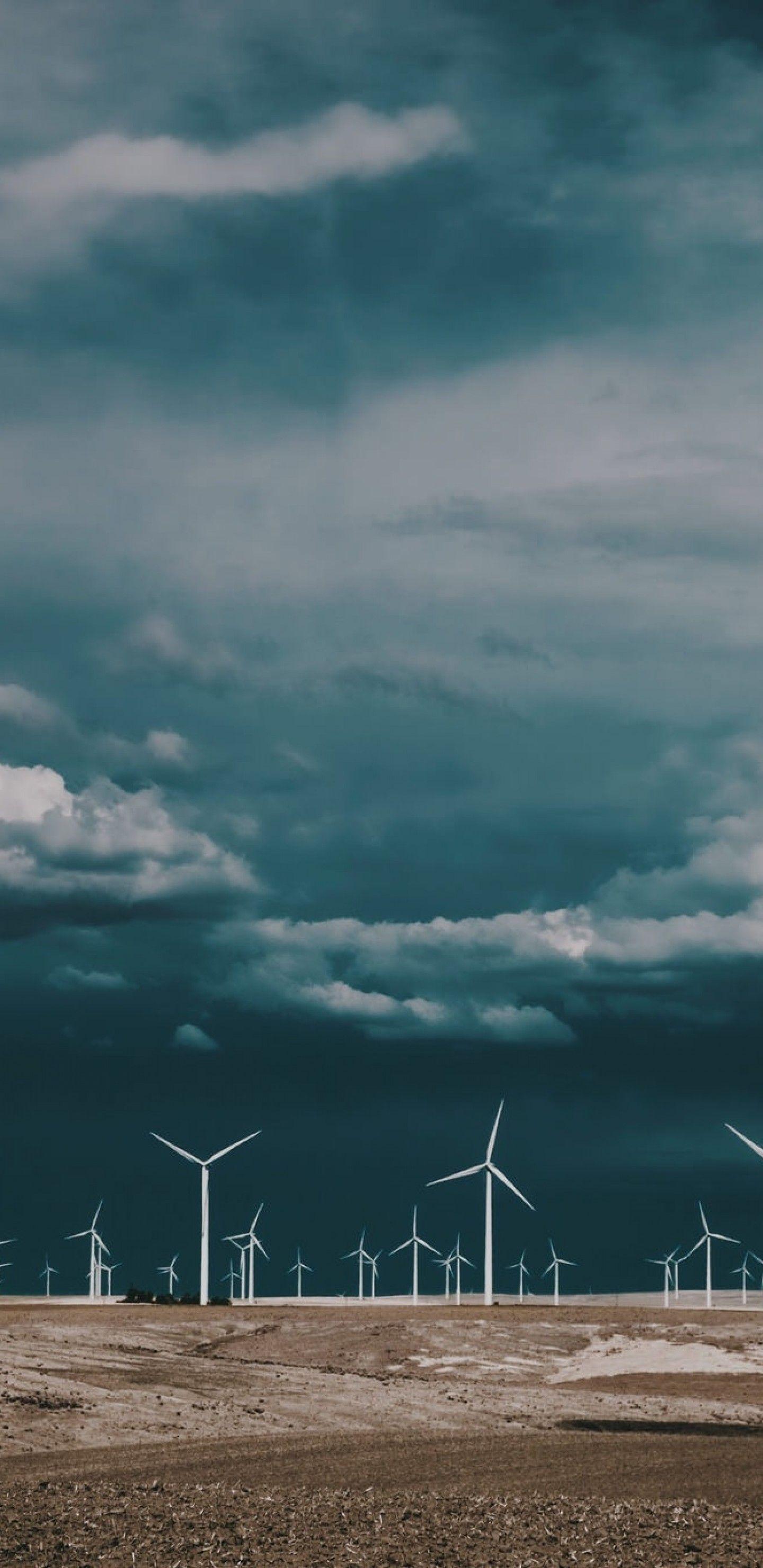 Download 1440x2960 Wind Turbine, Dark Clouds, Field, Energy