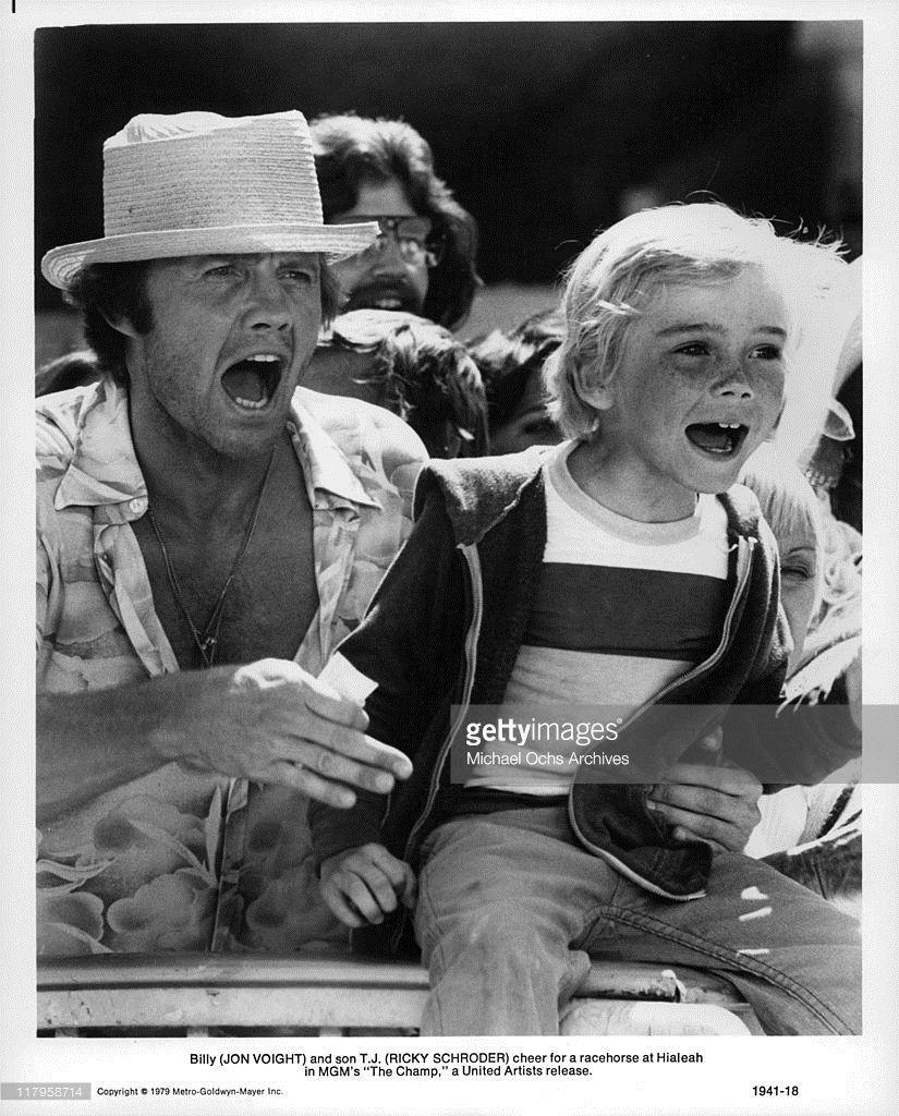 Jon Voight and Ricky Schroder cheer for racehorse in a scene