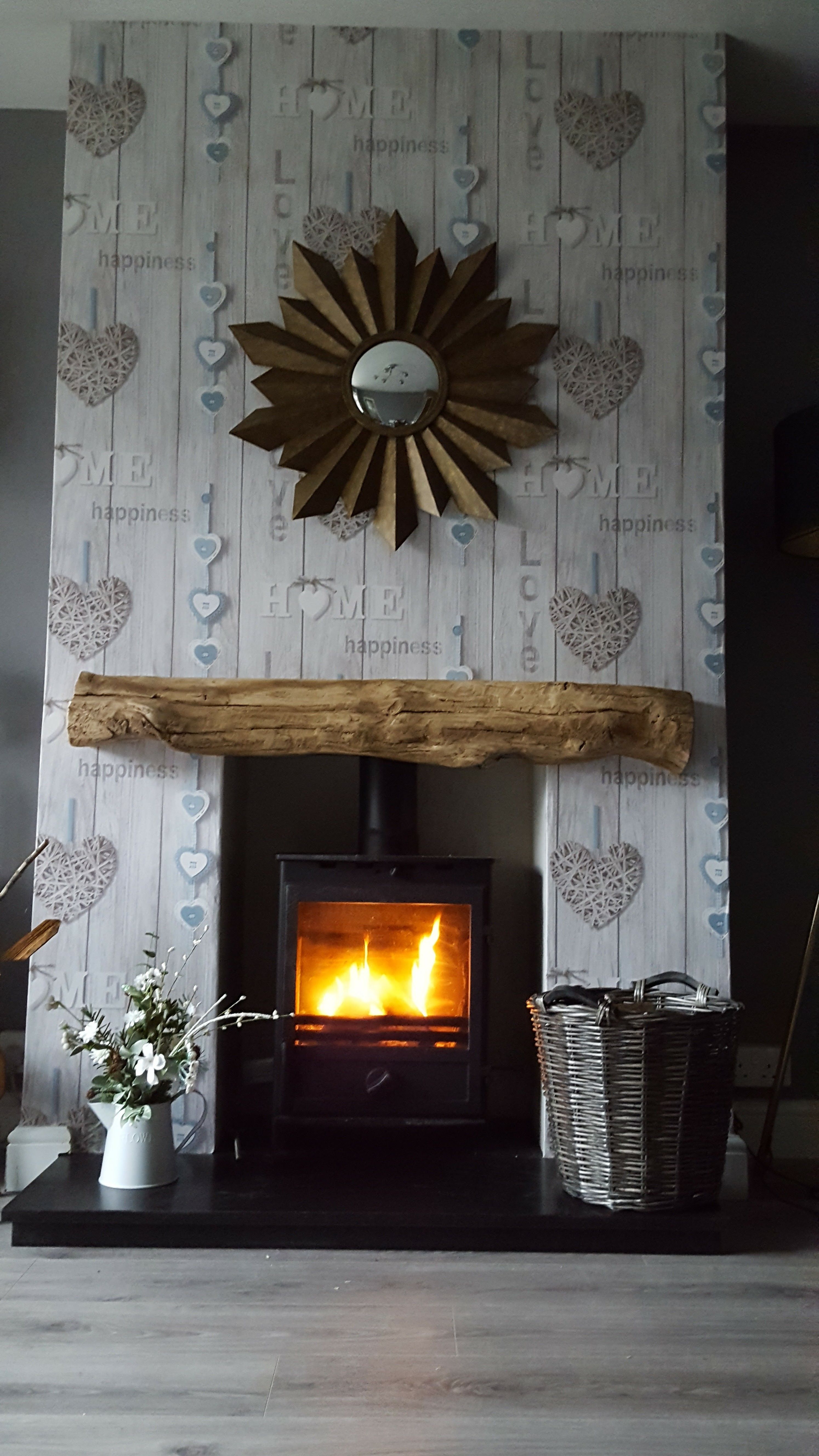 Installed this lovely wood burner and wallpapered chimney breast