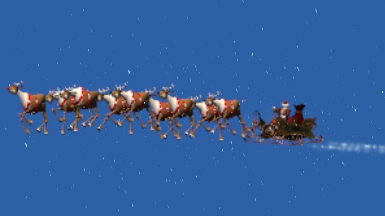 animated Santa Claus with sleigh in snowfall / black screen