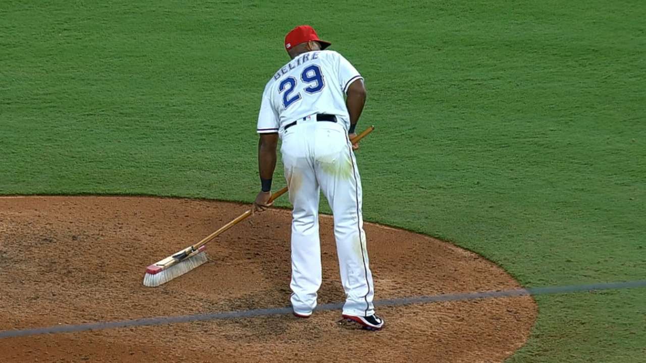 Adrian Beltre uses grounds crew's broom to help him avoid a postgame