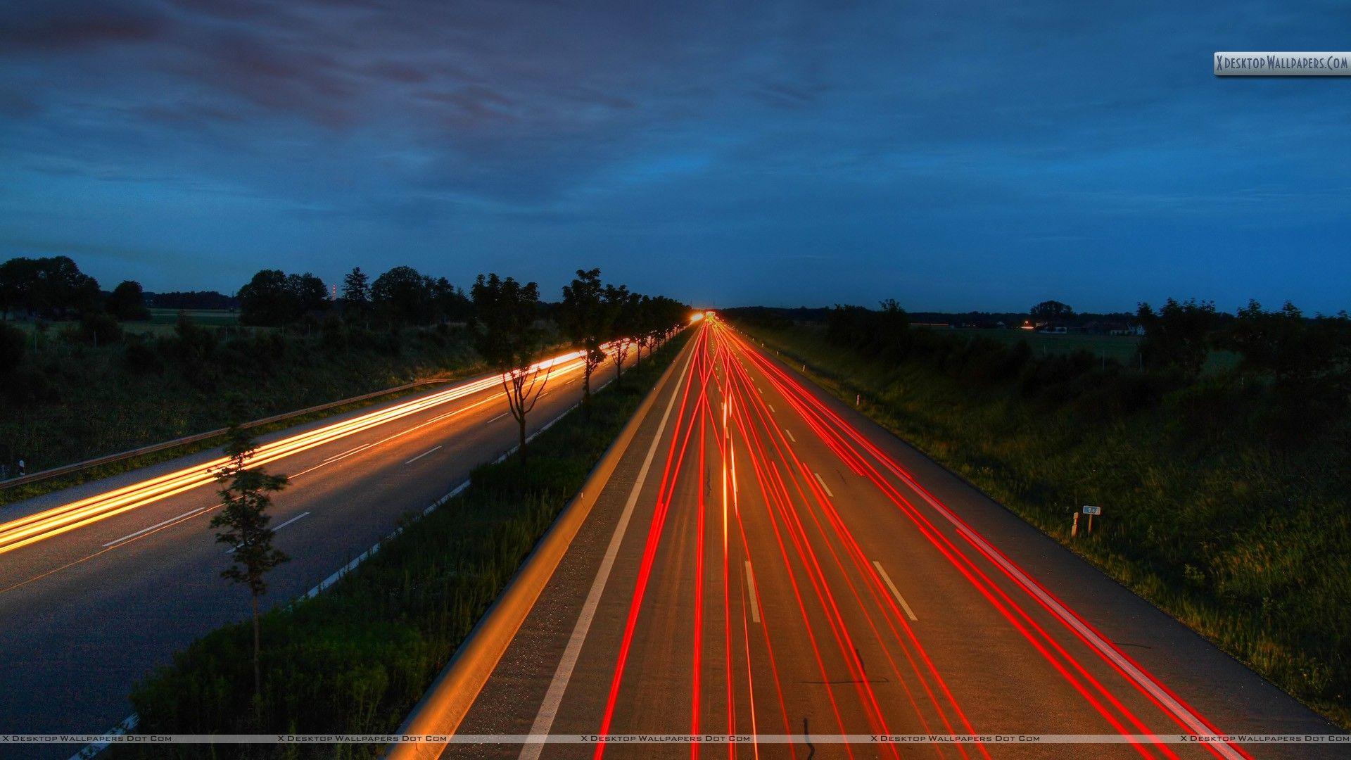 Red Led Lights On Highway At Evening Wallpaper