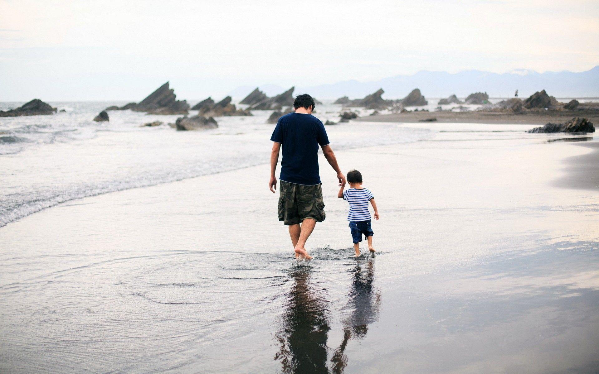 Father and son are walking on the water wallpaper and image